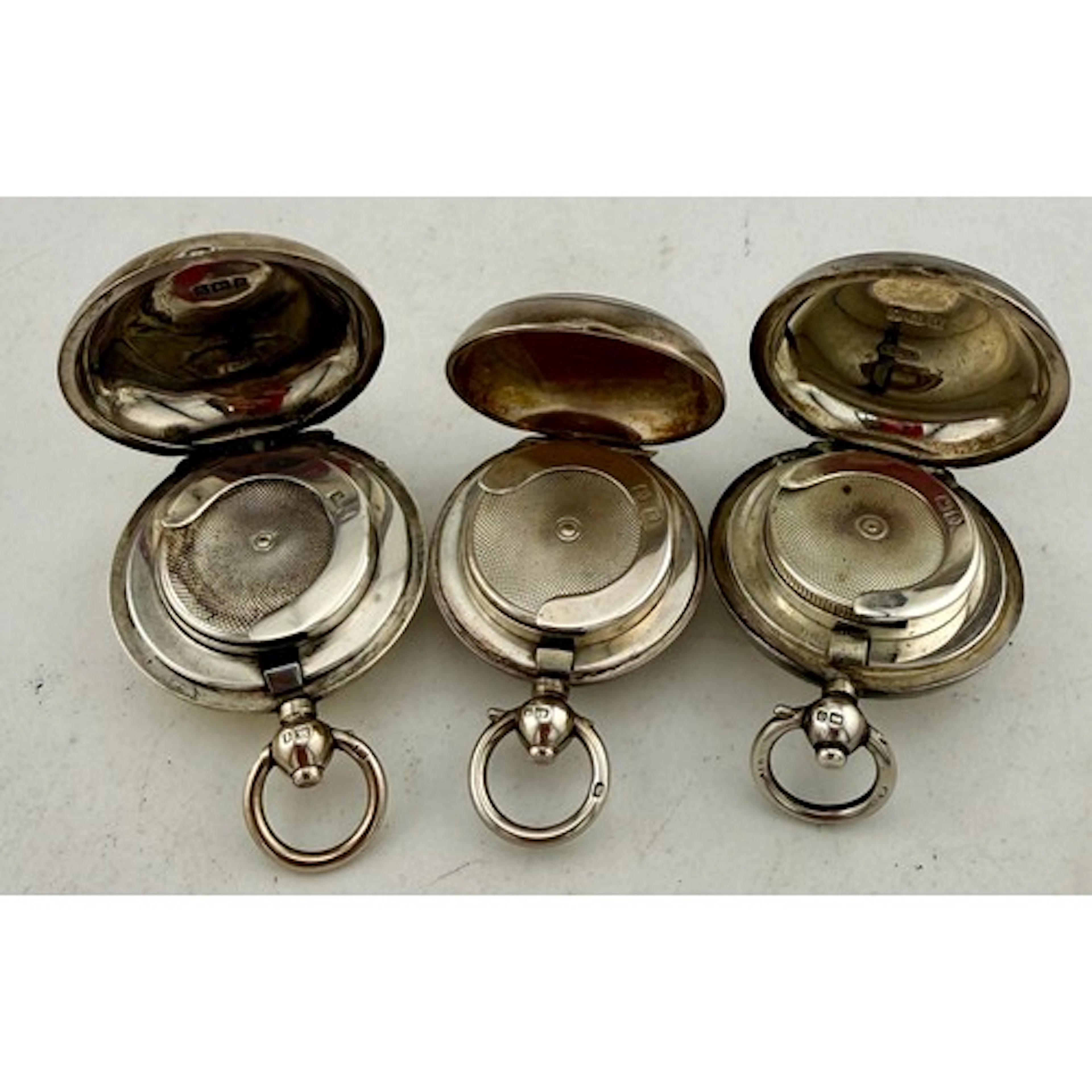 Three hallmarked silver sovereign holders, Birmingham 1906, ...