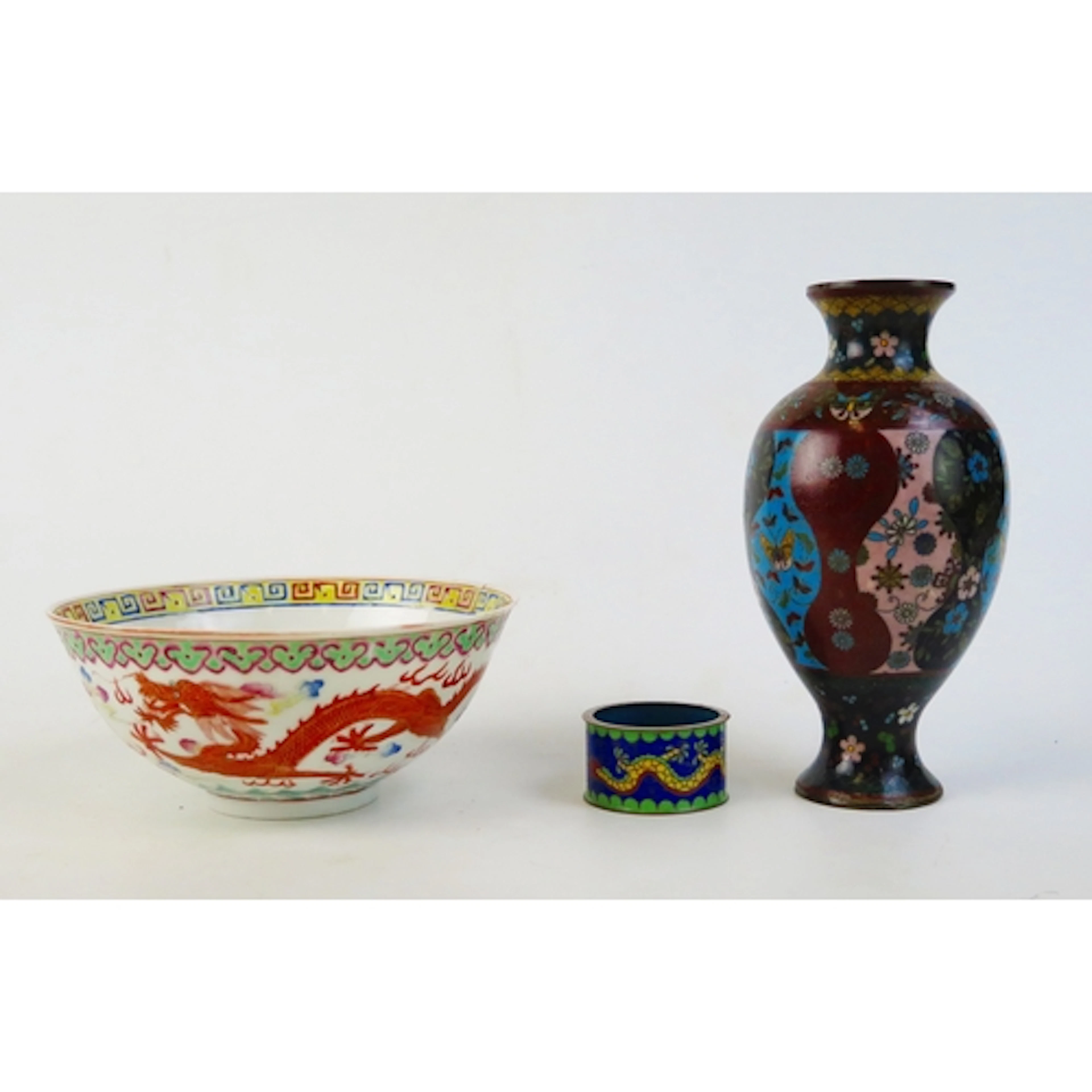 A Japanese cloisonné vase, of urn form, with polychrome deco...