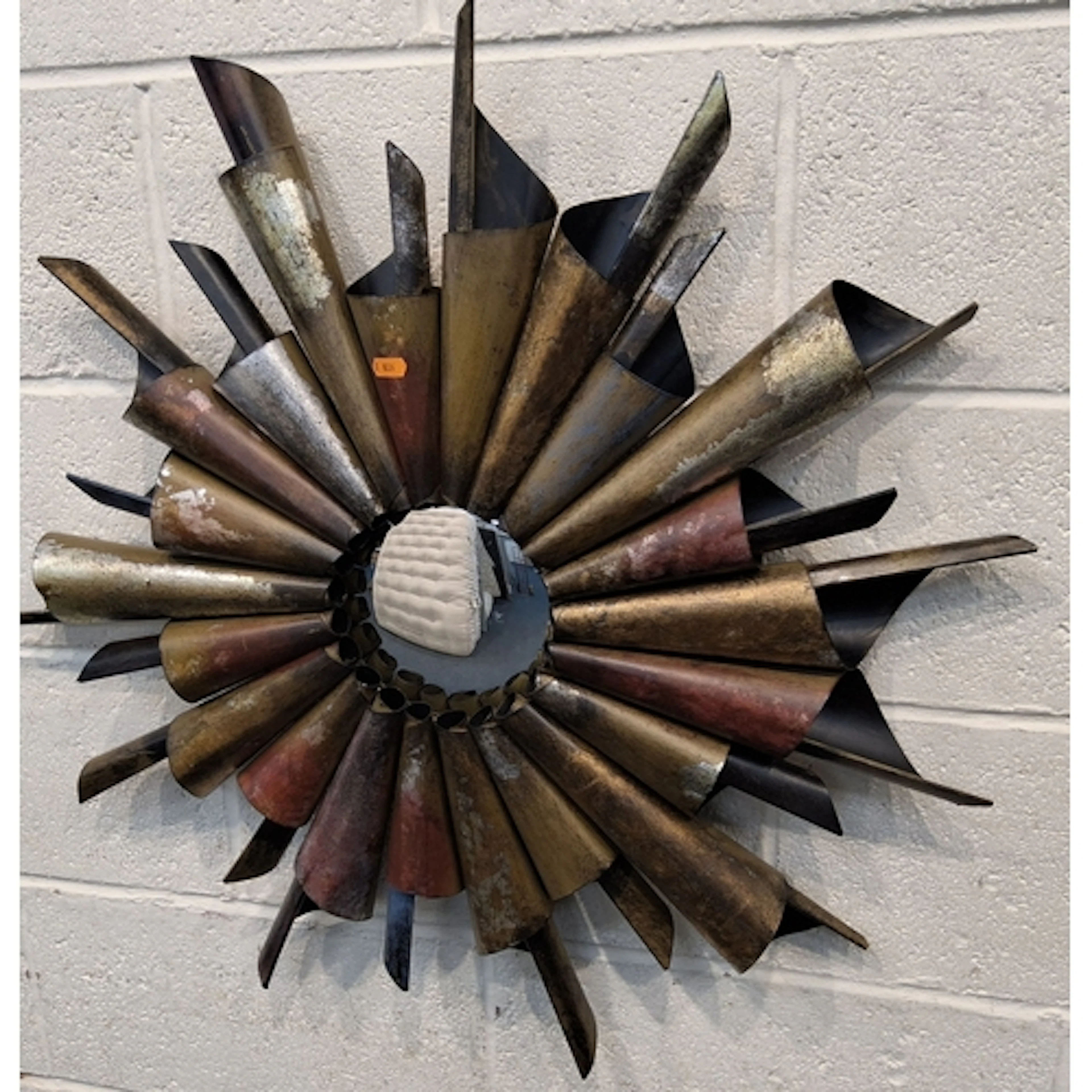 A MODERN METAL INDUSTRIAL STYLE WALL MIRROR, with a coned fr...