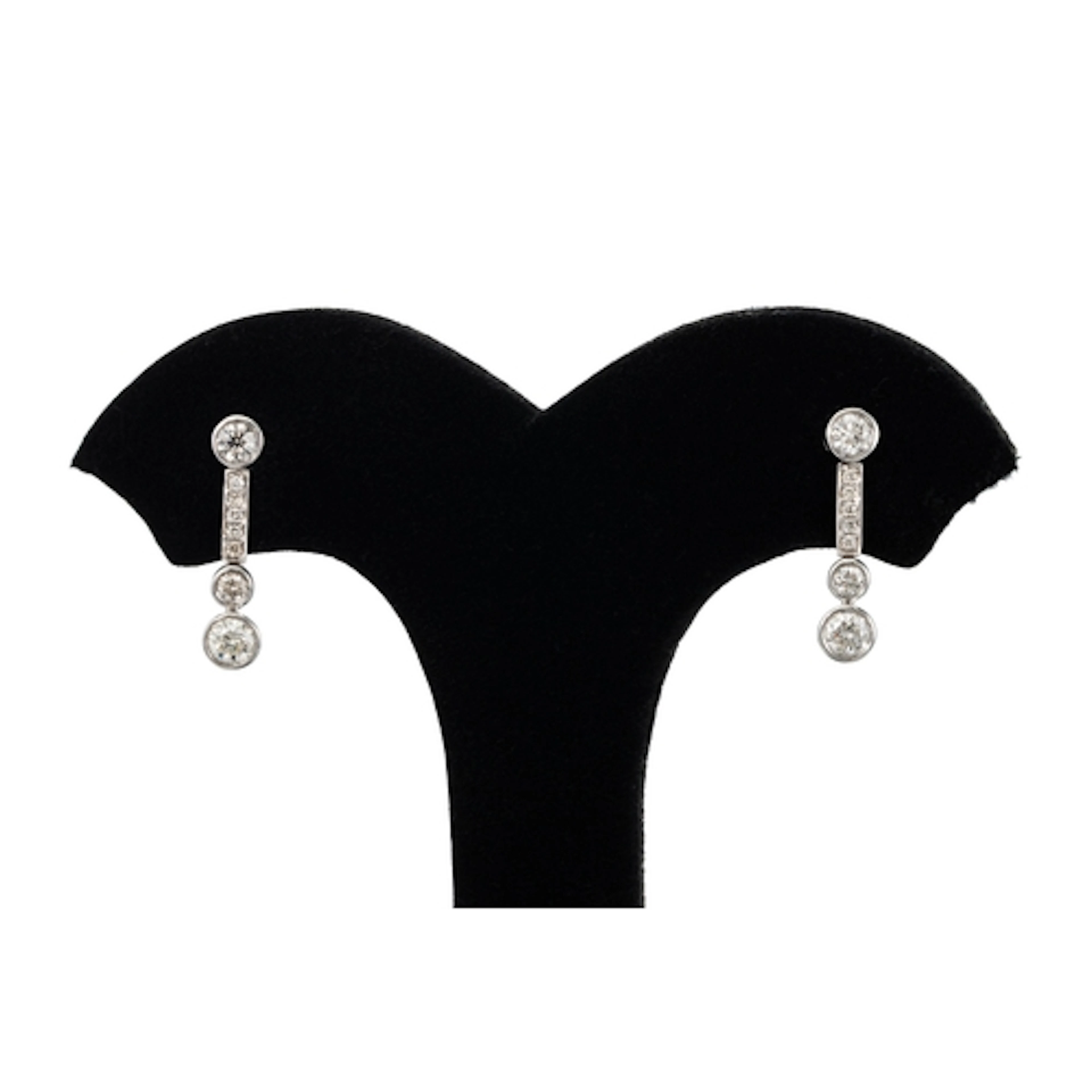 A PAIR OF DIAMOND DROP EARRINGS, the bezel set round brillia...