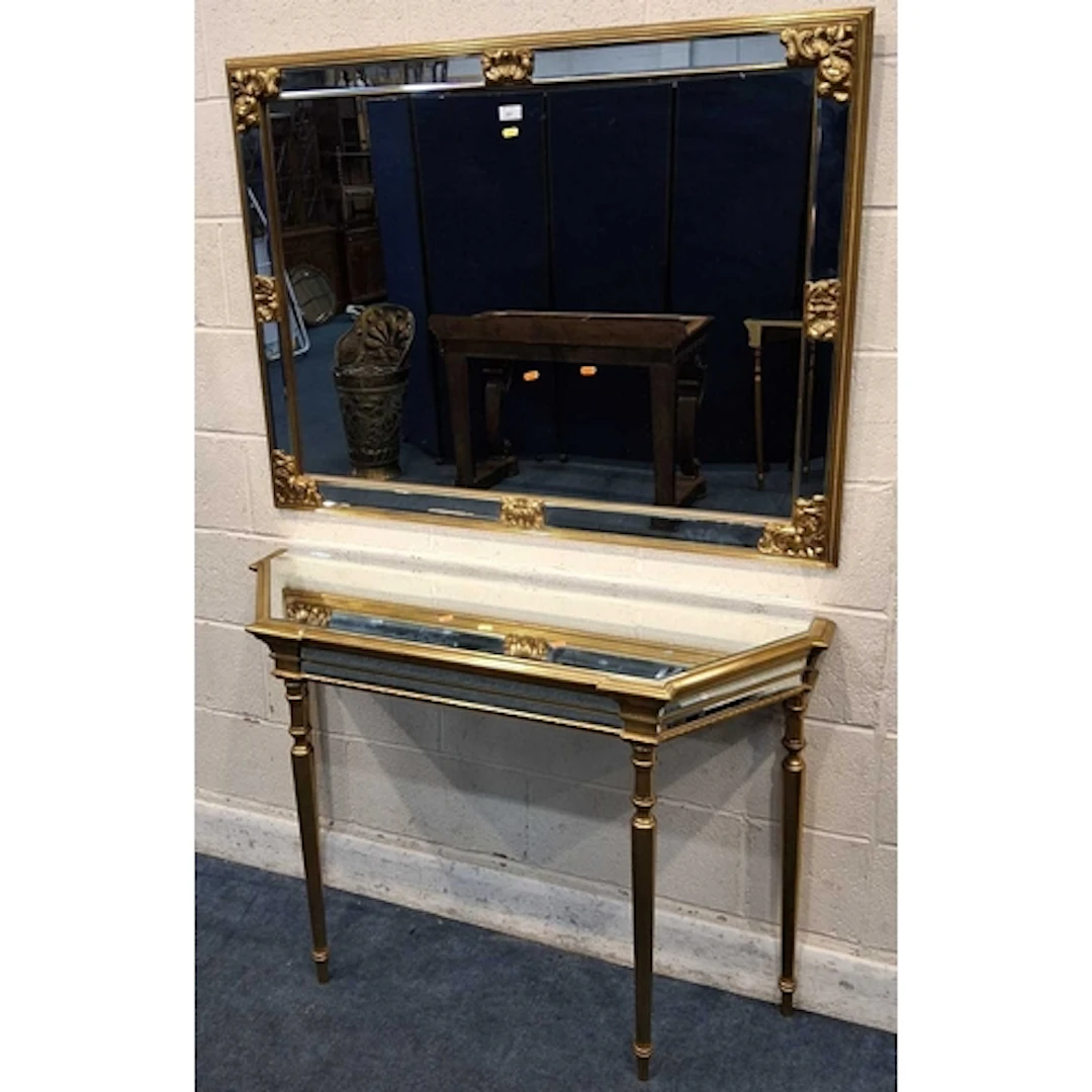 A GILT WOOD RECTANGULAR WALL MIRROR, along with a console ta...