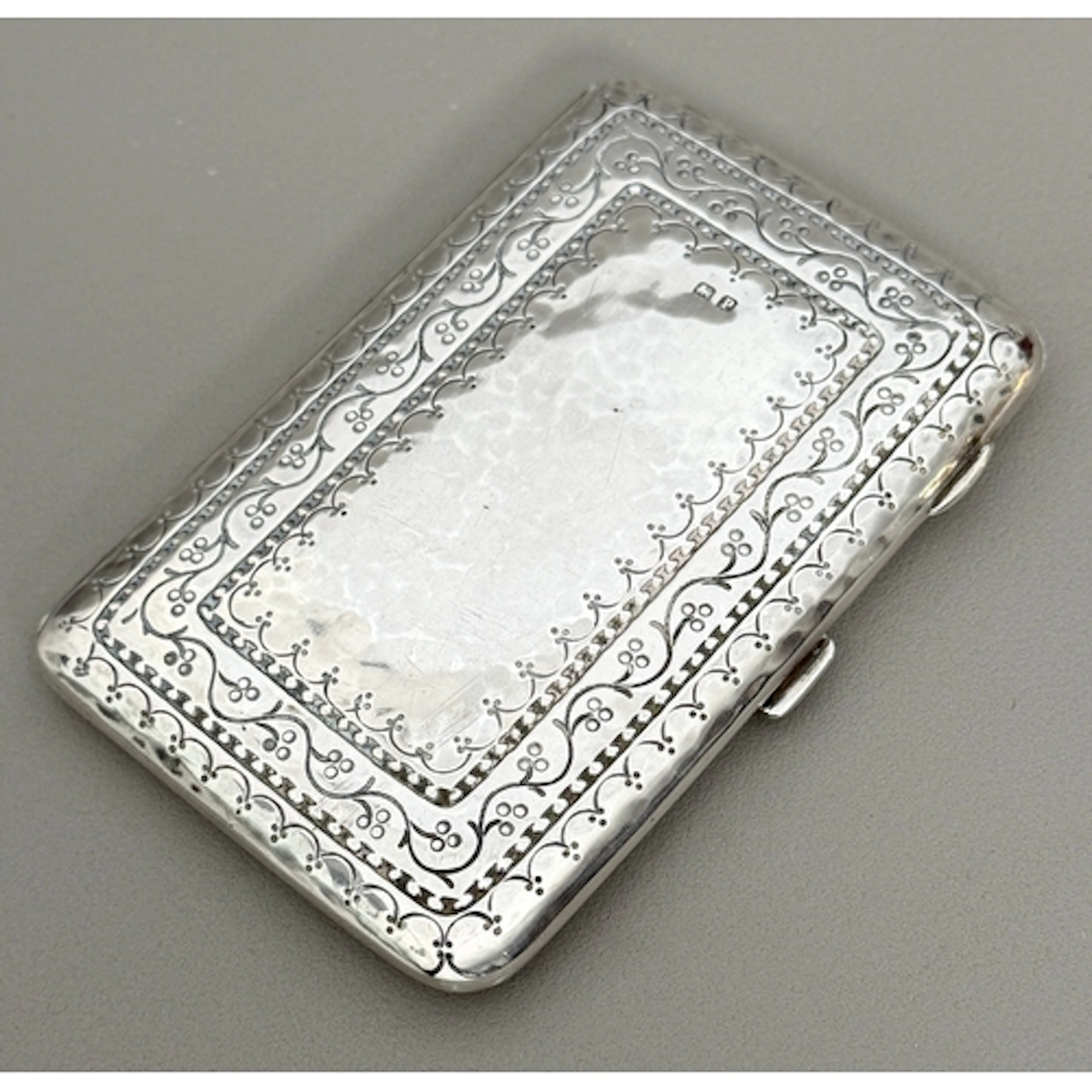 A George V silver card and stamp case by Liberty & Co - Birm...