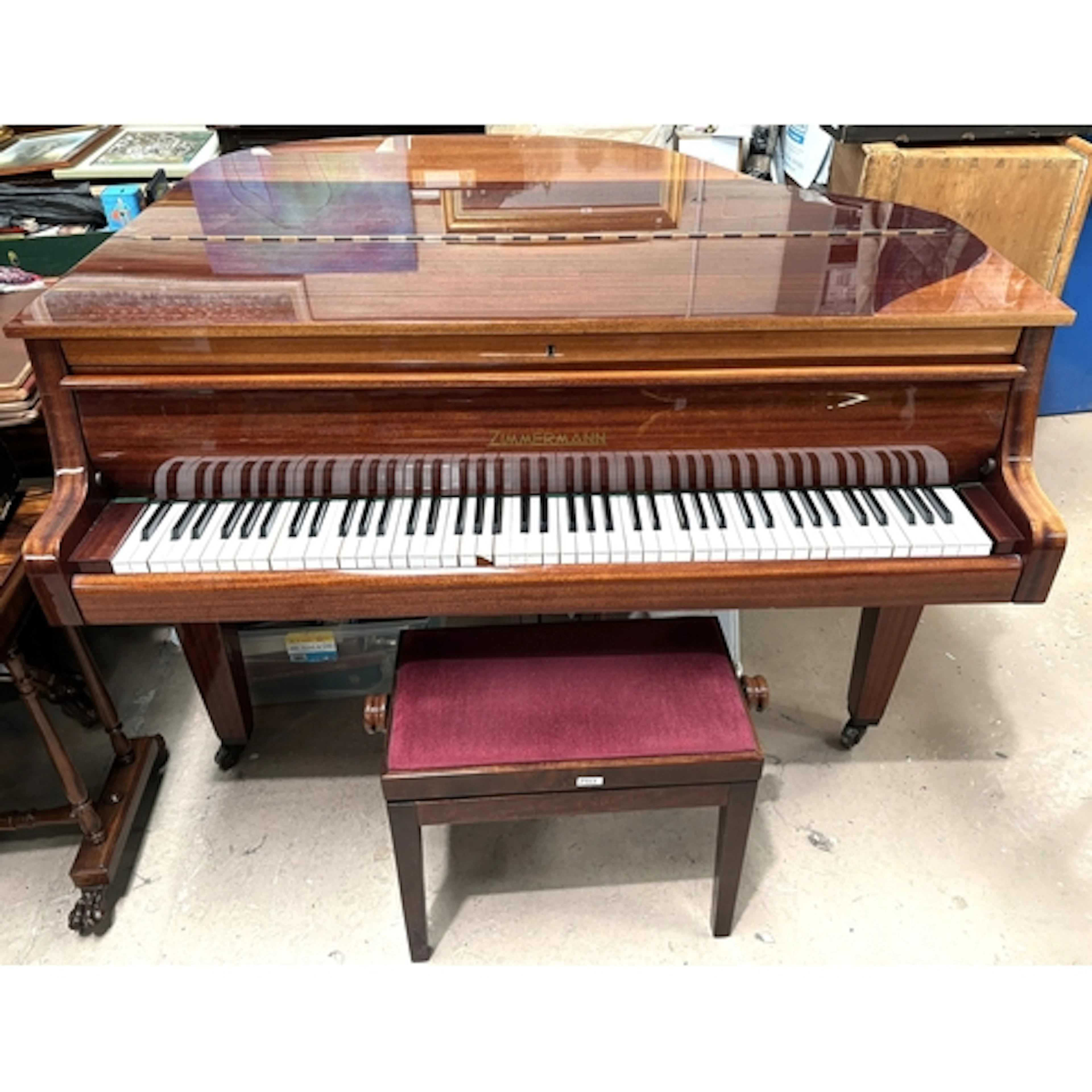 A modern sapele mahogany cased, baby grand piano, iron frame...