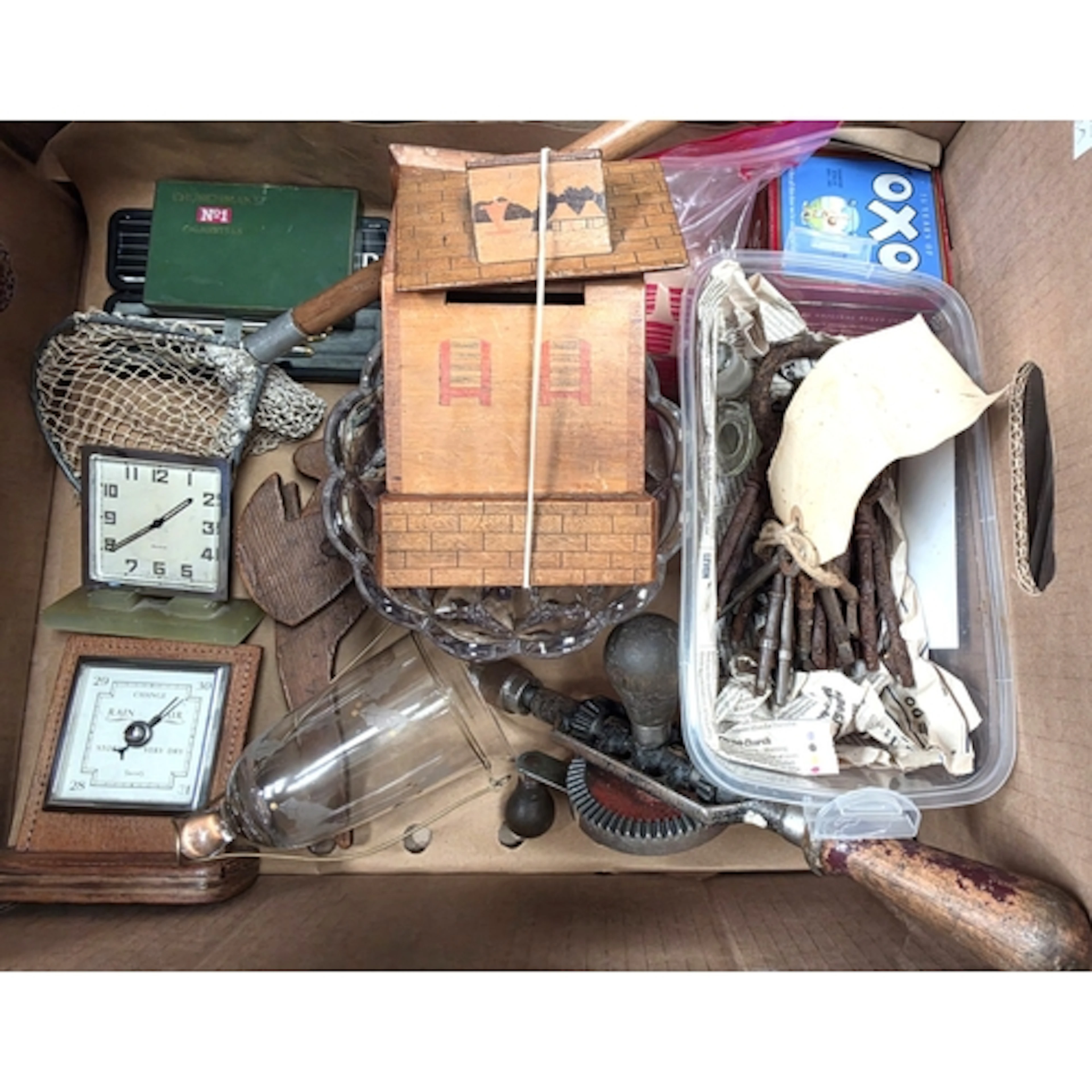 A collection of antique keys, Art Deco desk clock and barome...