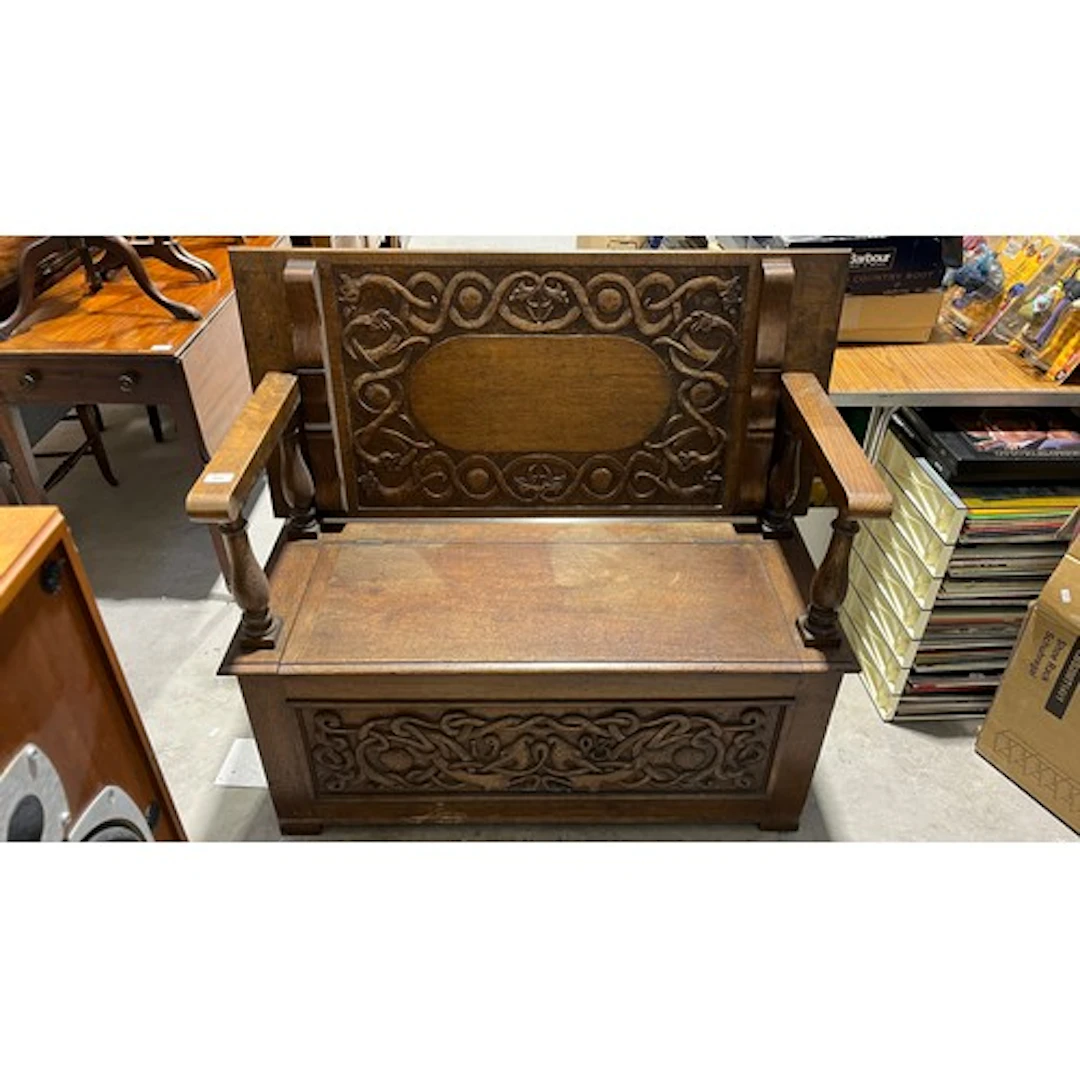 Oak arts and crafts style carved monks bench, 104cm long