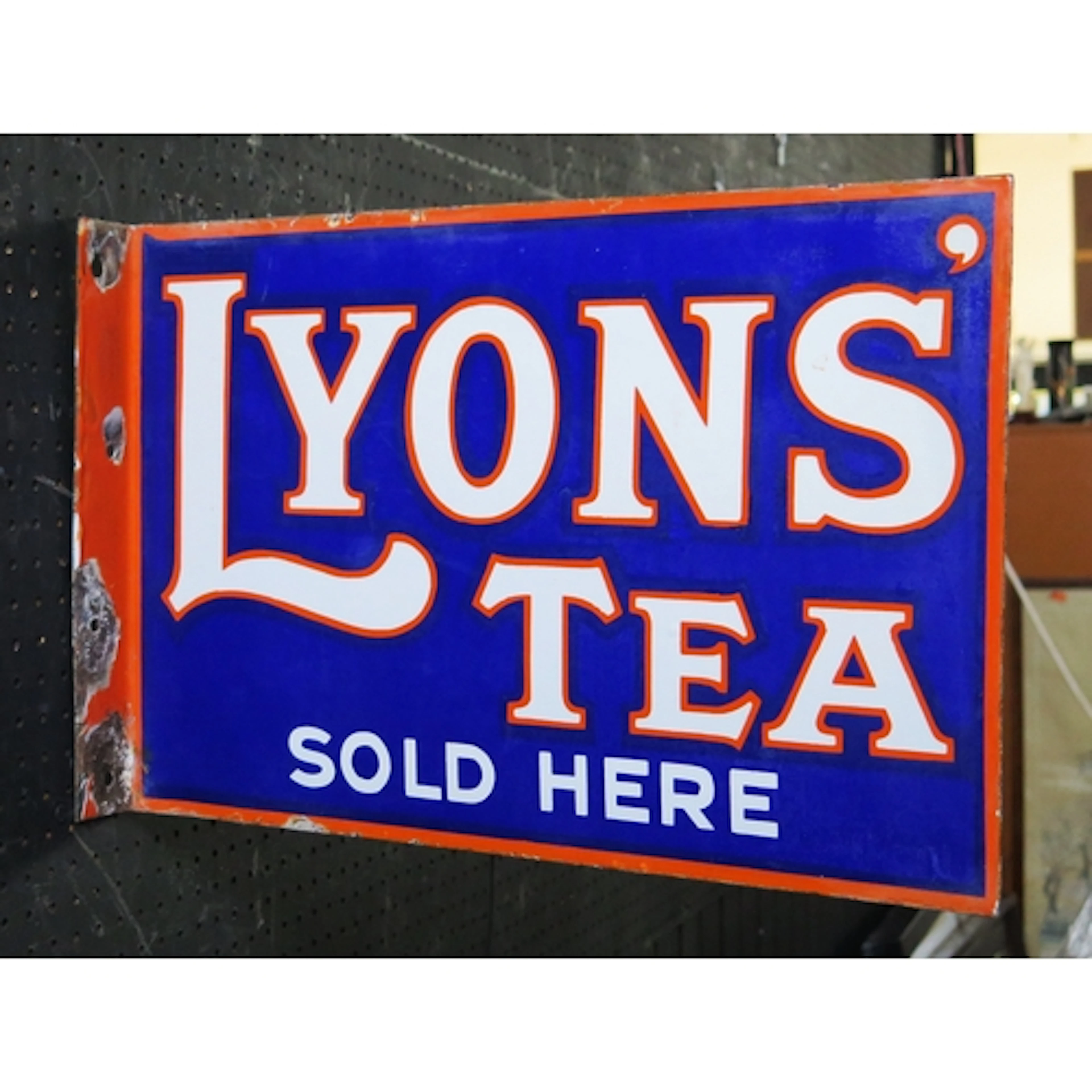 "Lyons' Tea Sold Here" - an enamel double sided advertising ...