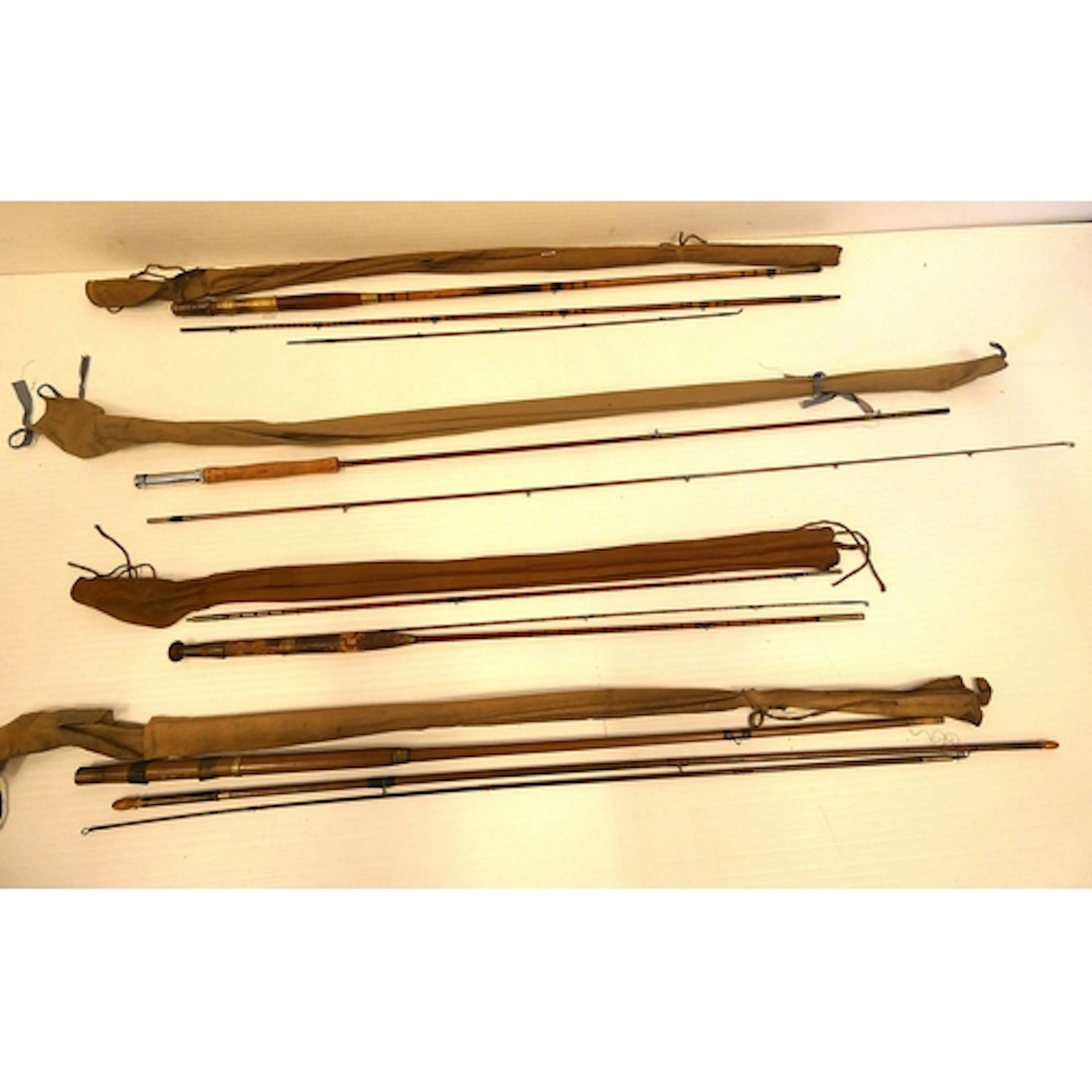 Vintage split cane and bamboo three piece fishing rod, with ...