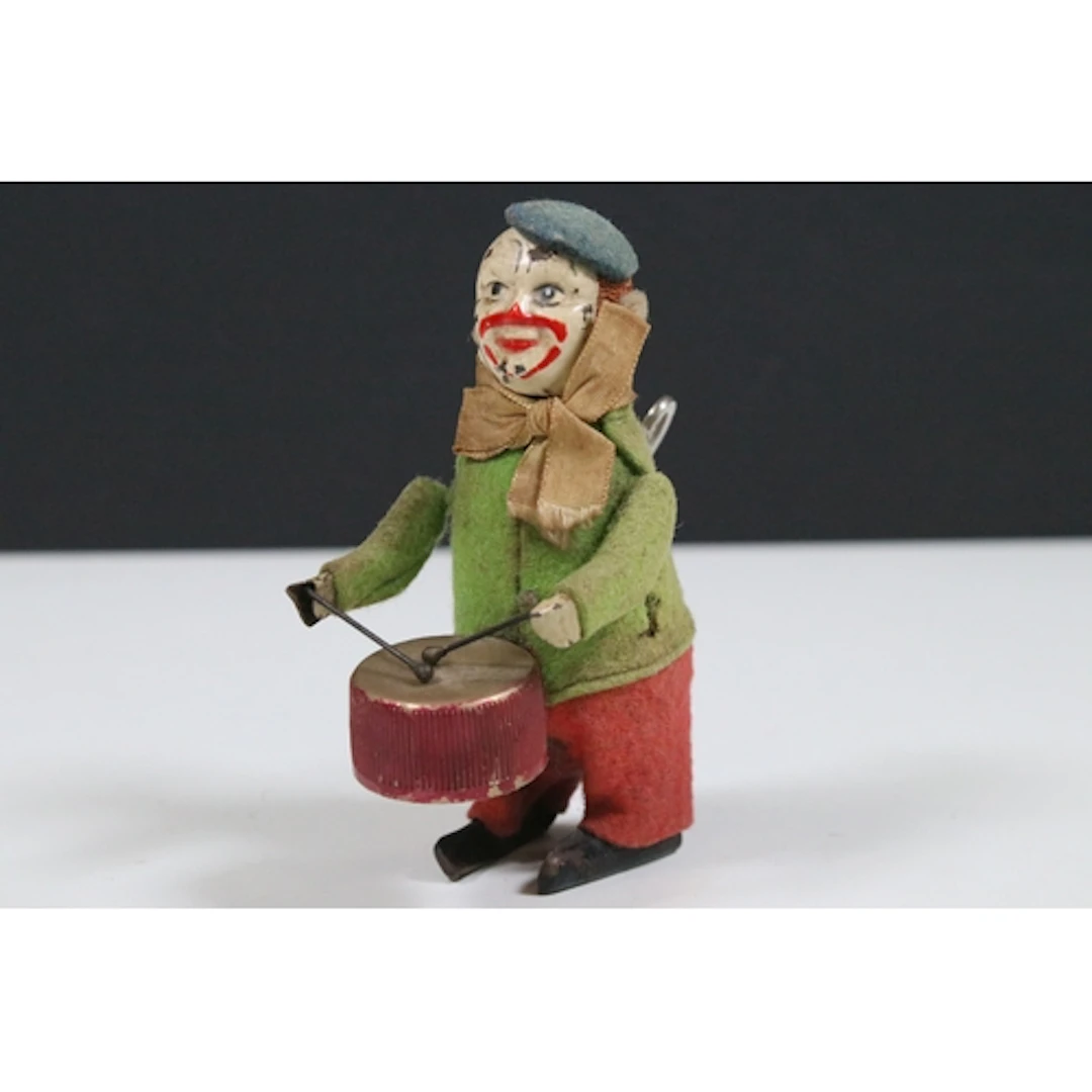 Schuco style clockwork model clown drummer, with 'Fabricatio...