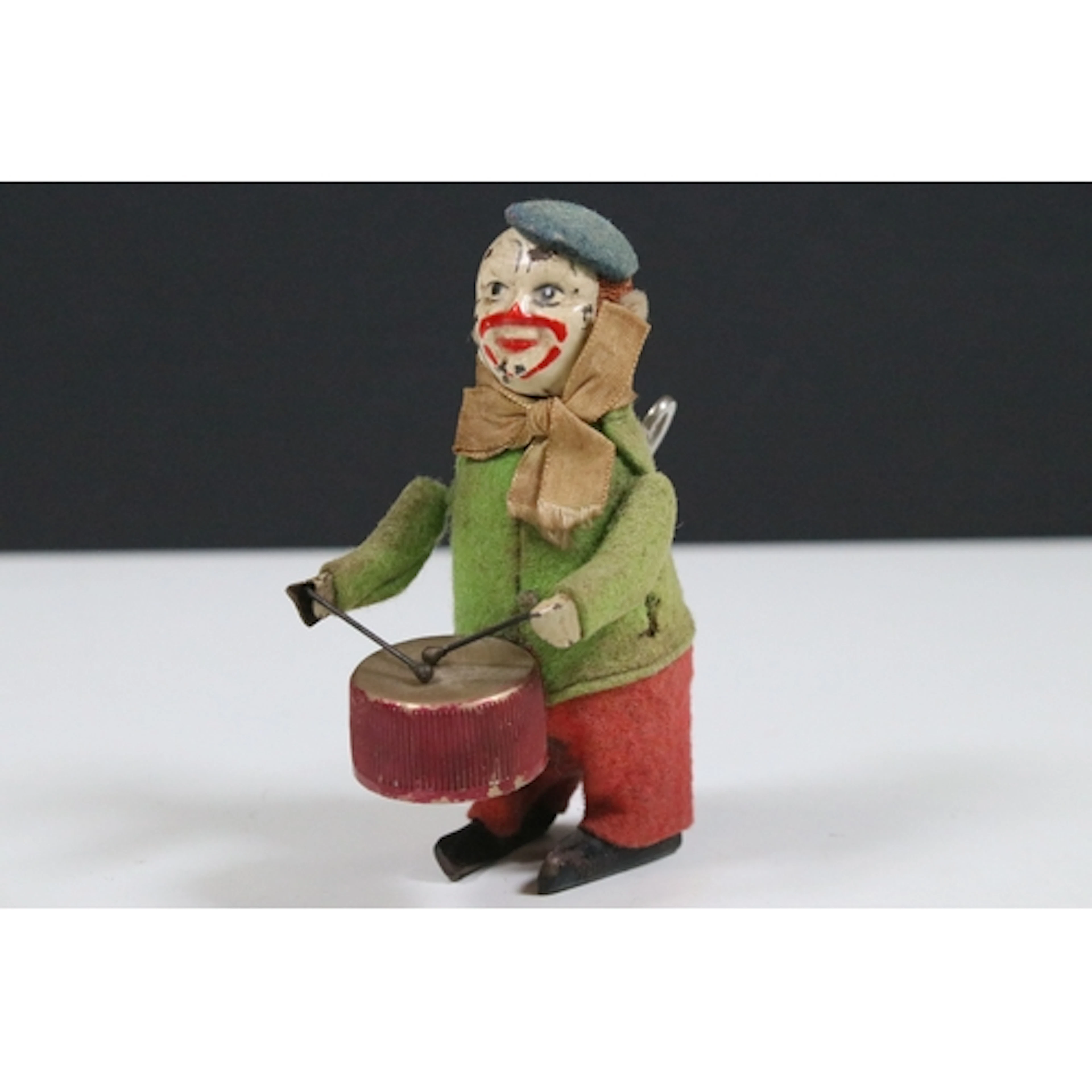 Schuco style clockwork model clown drummer, with 'Fabricatio...