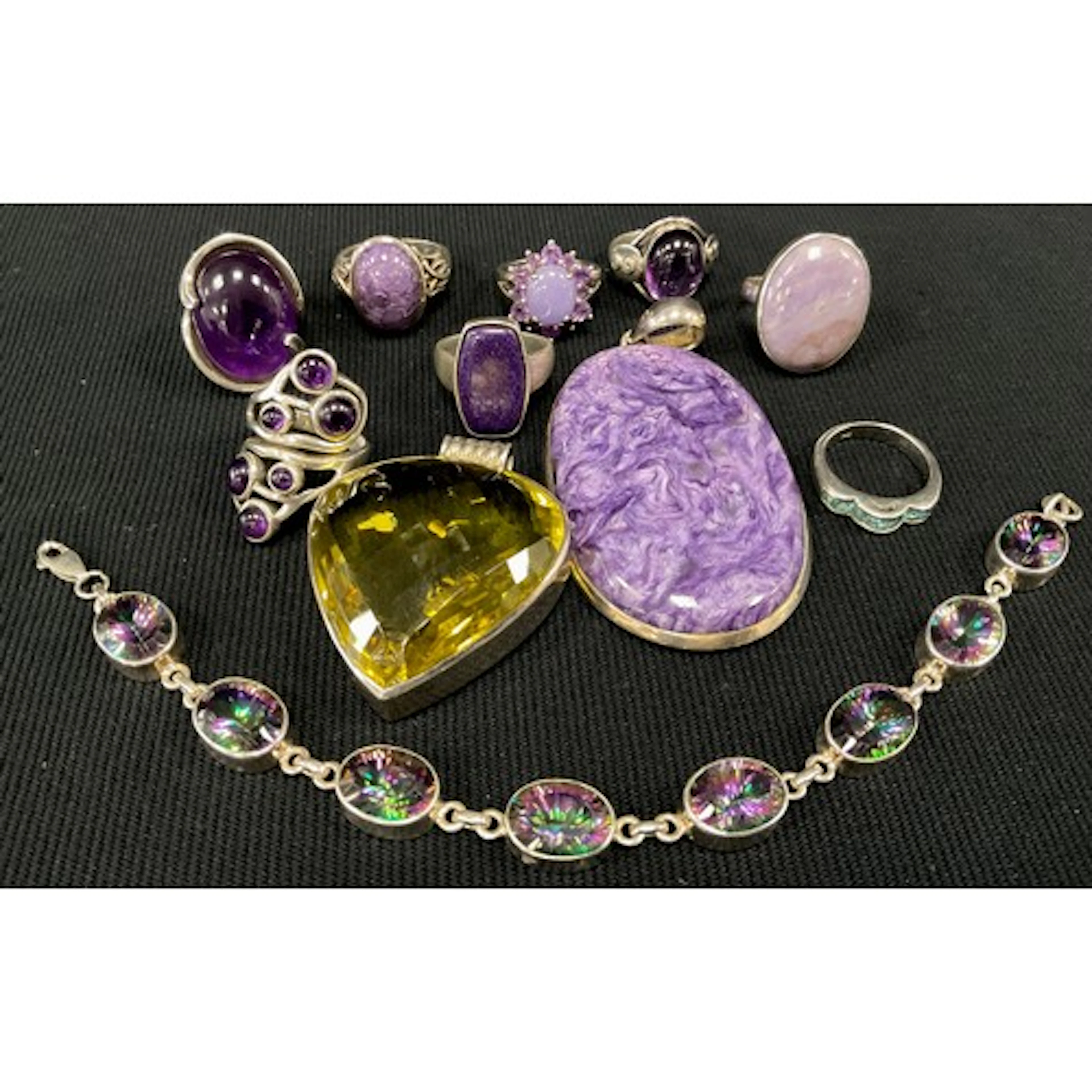 A purple charoite and silver pendant, stamped 925, similar d...
