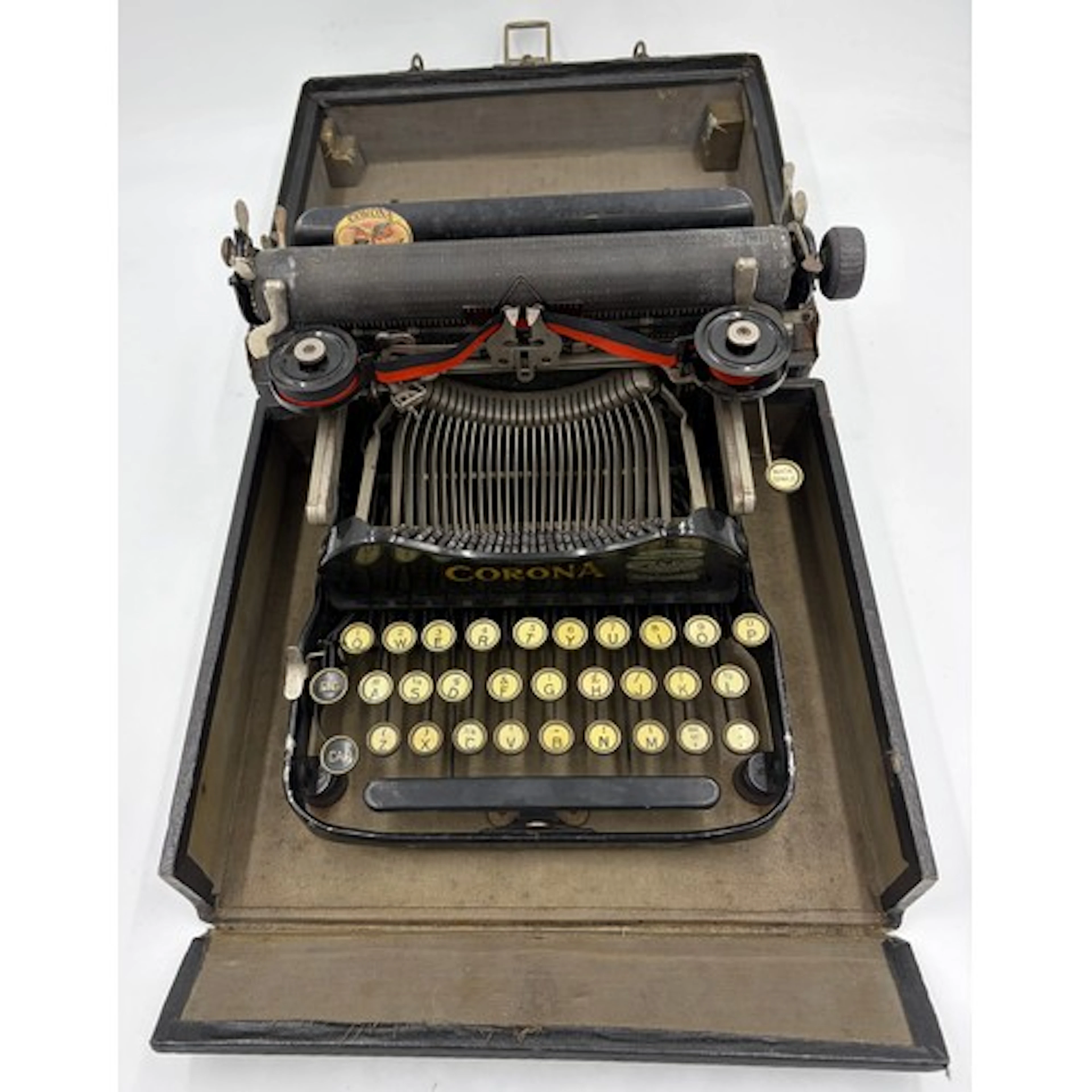A Portable Corona QWERTY Typewriter, black, all keys appear ...