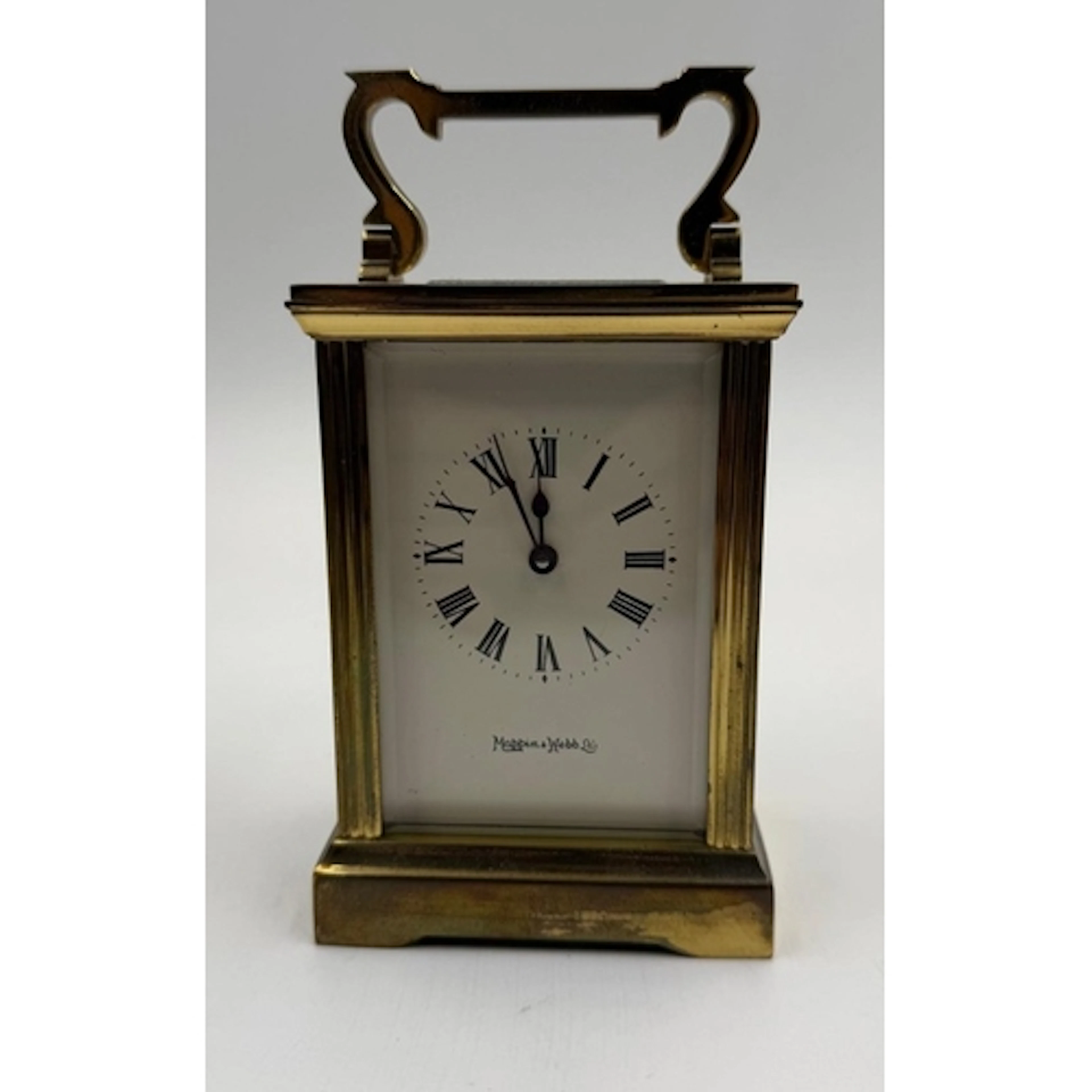 A brass Mappin and Webb carriage clock.