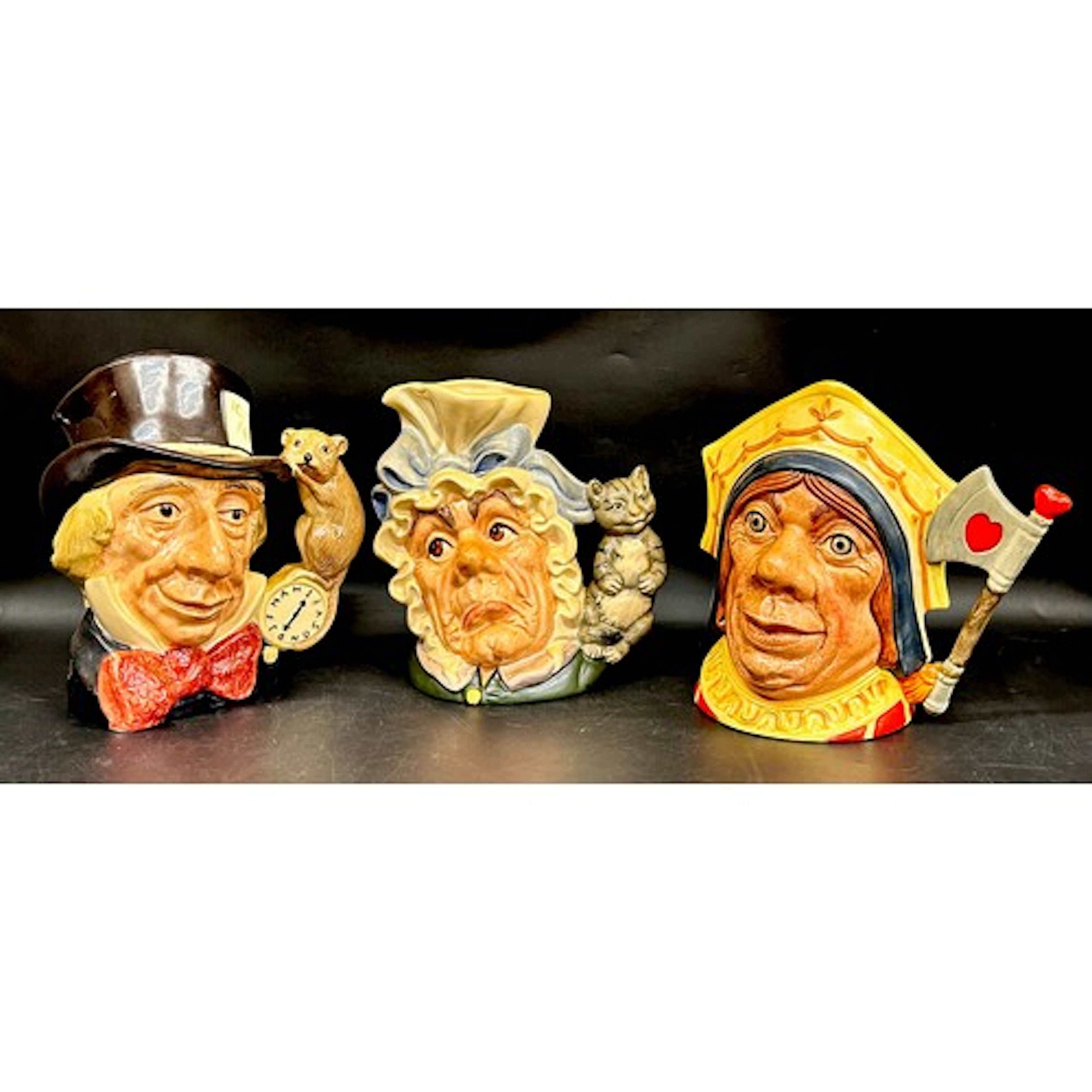 Three Royal Doulton Alice in Wonderland themed large charact...