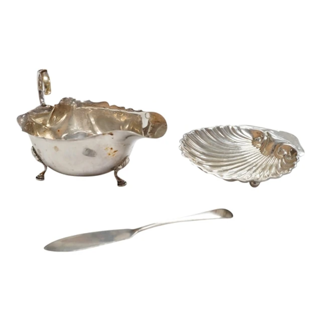A George V silver sauce boat, Birmingham, 1930, a silver she...