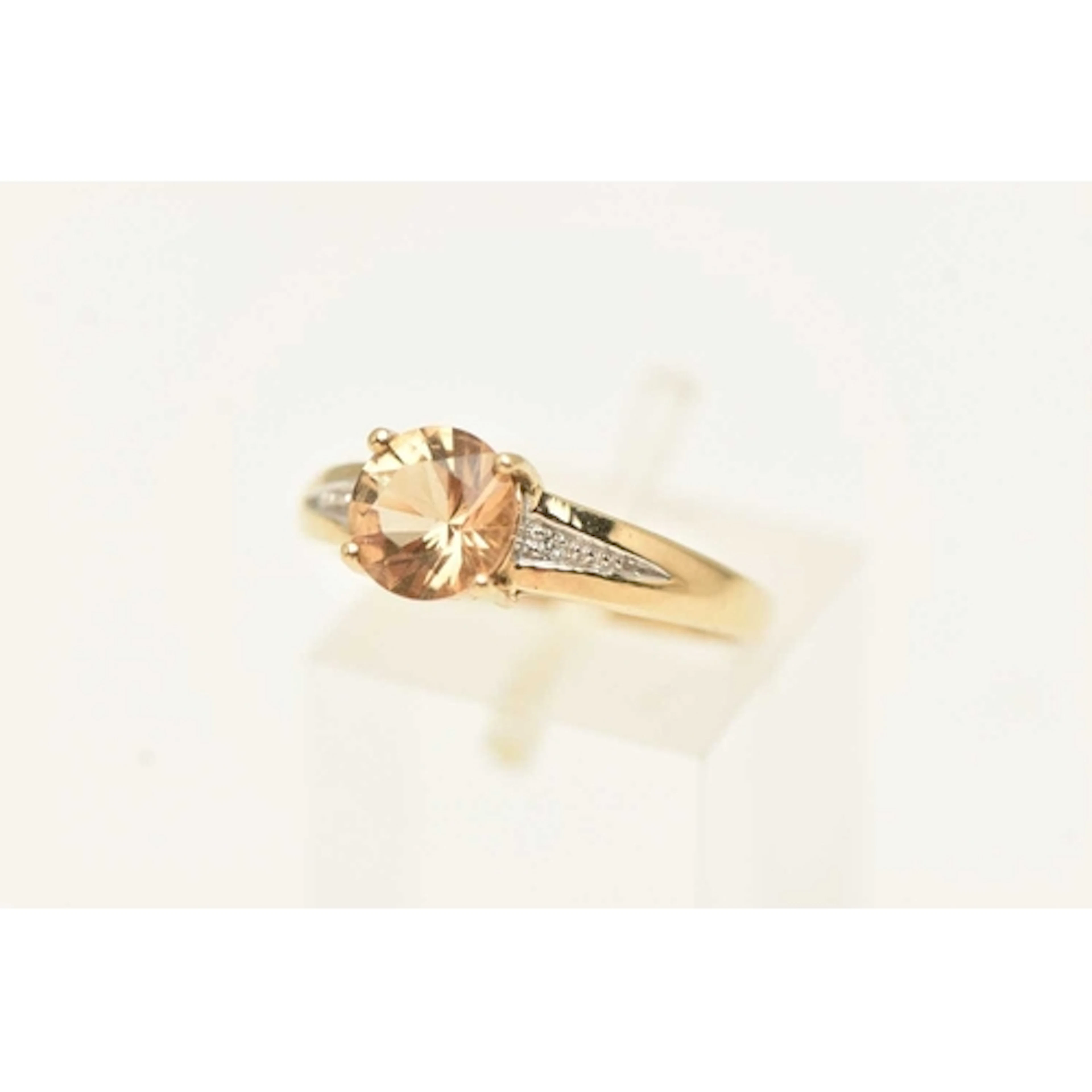 A 9CT YELLOW GOLD GEM SET RING, a circular cut brown beryl '...