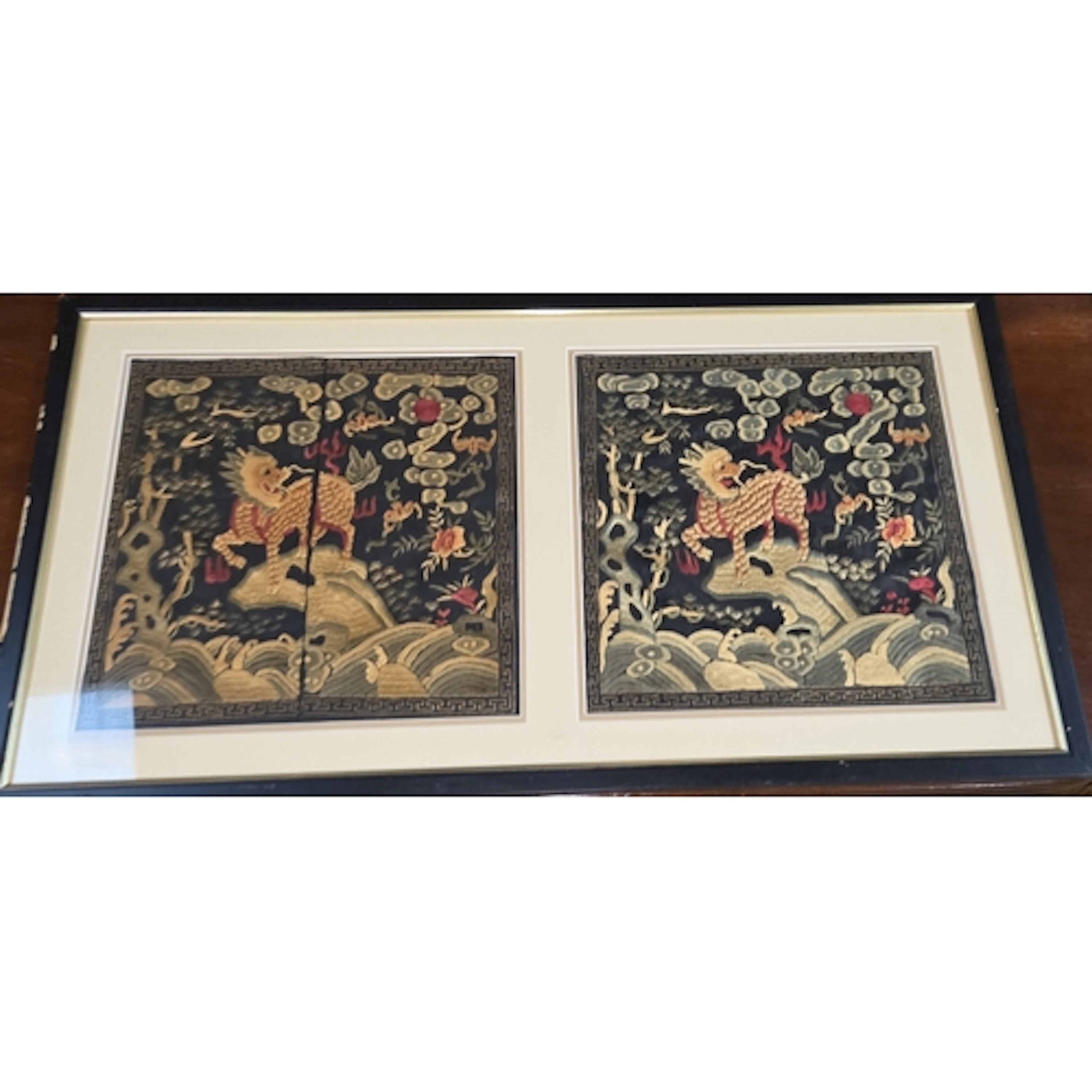 A pair of Chinese silk embroidered rank badges featuring a l...