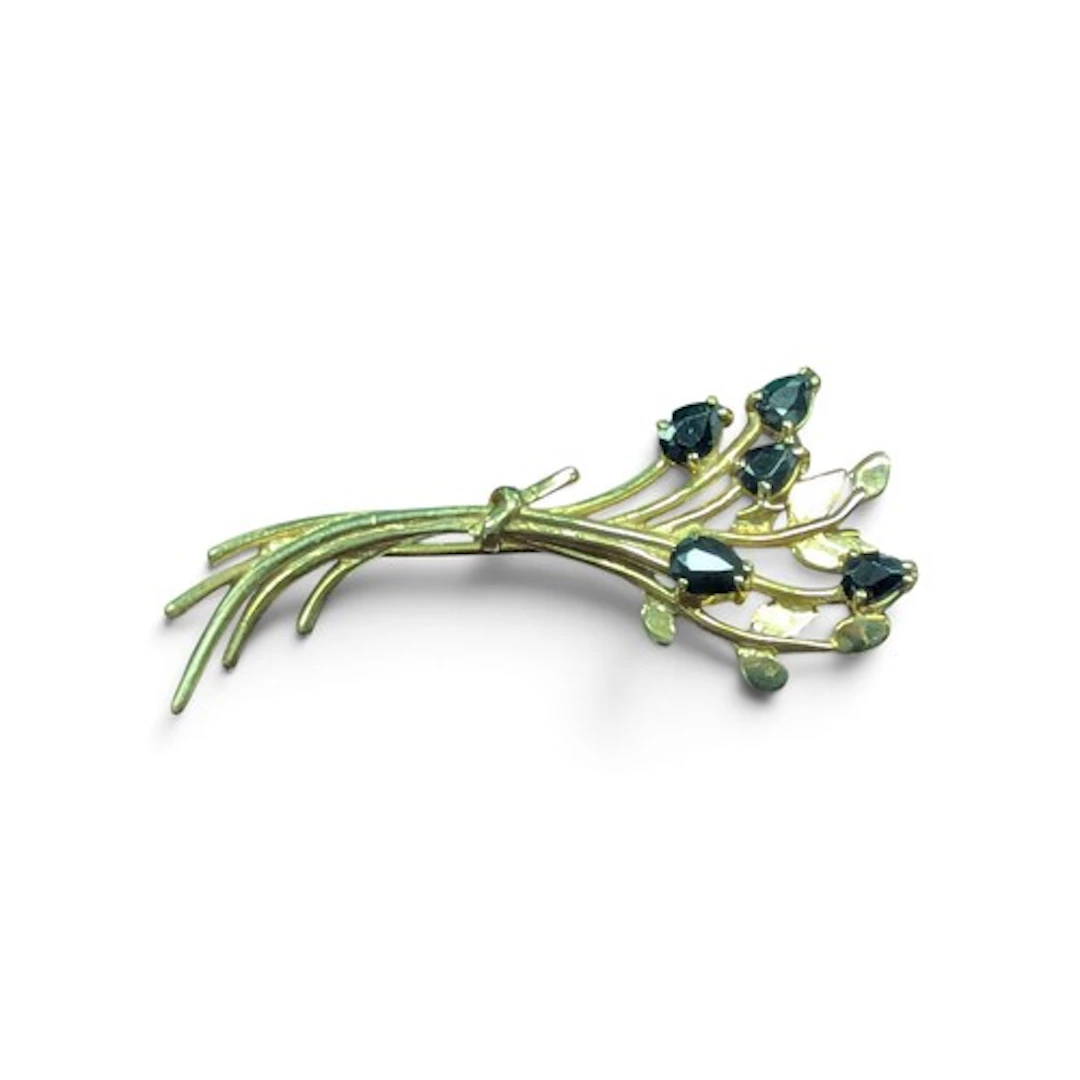 A 9ct gold brooch set with sapphires, stamped 375, 2.8g gros...
