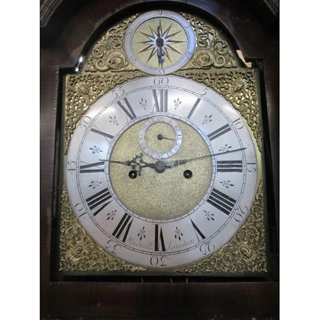 An 18th century walnut long cased clock the brass dial with...