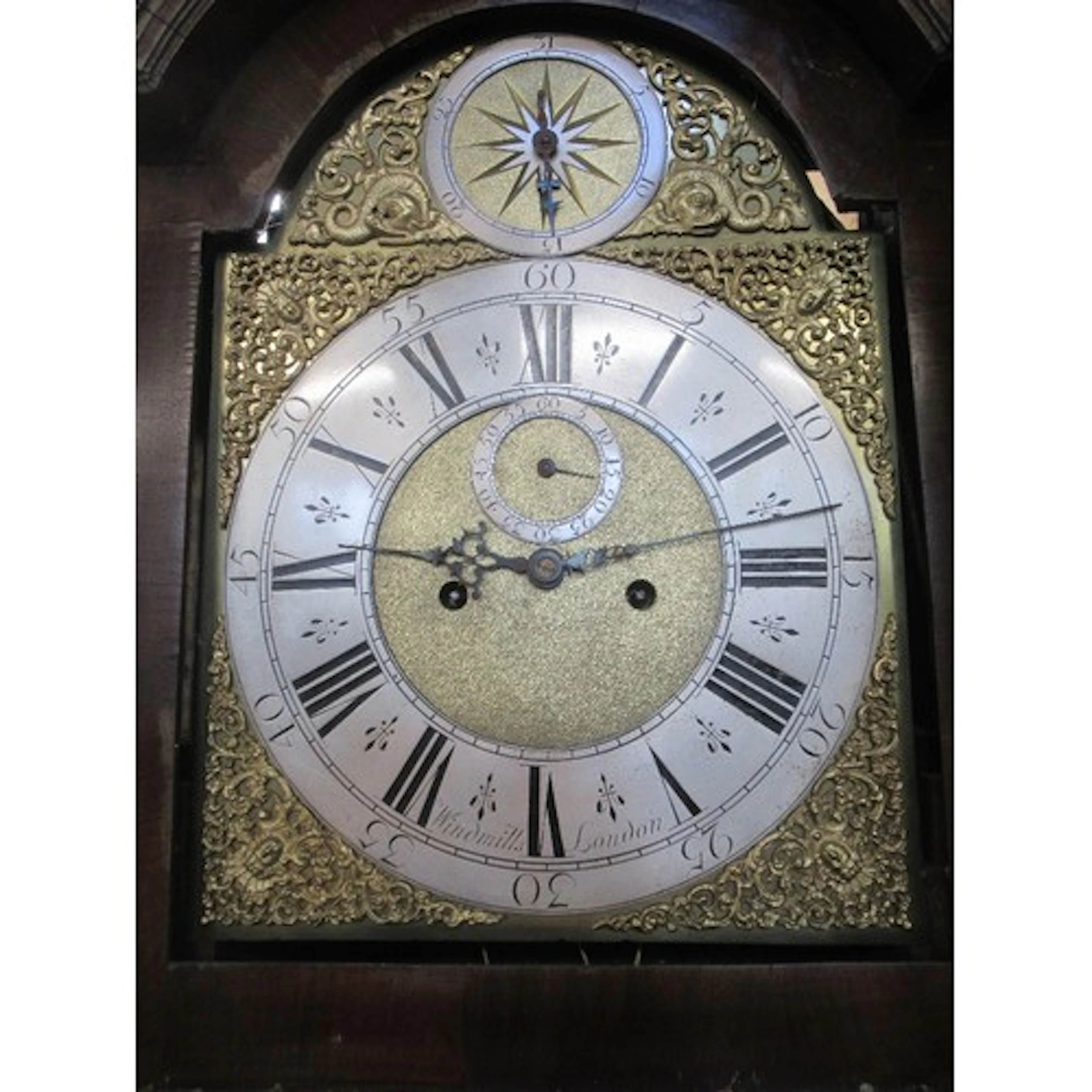 An 18th century walnut long cased clock the brass dial with...
