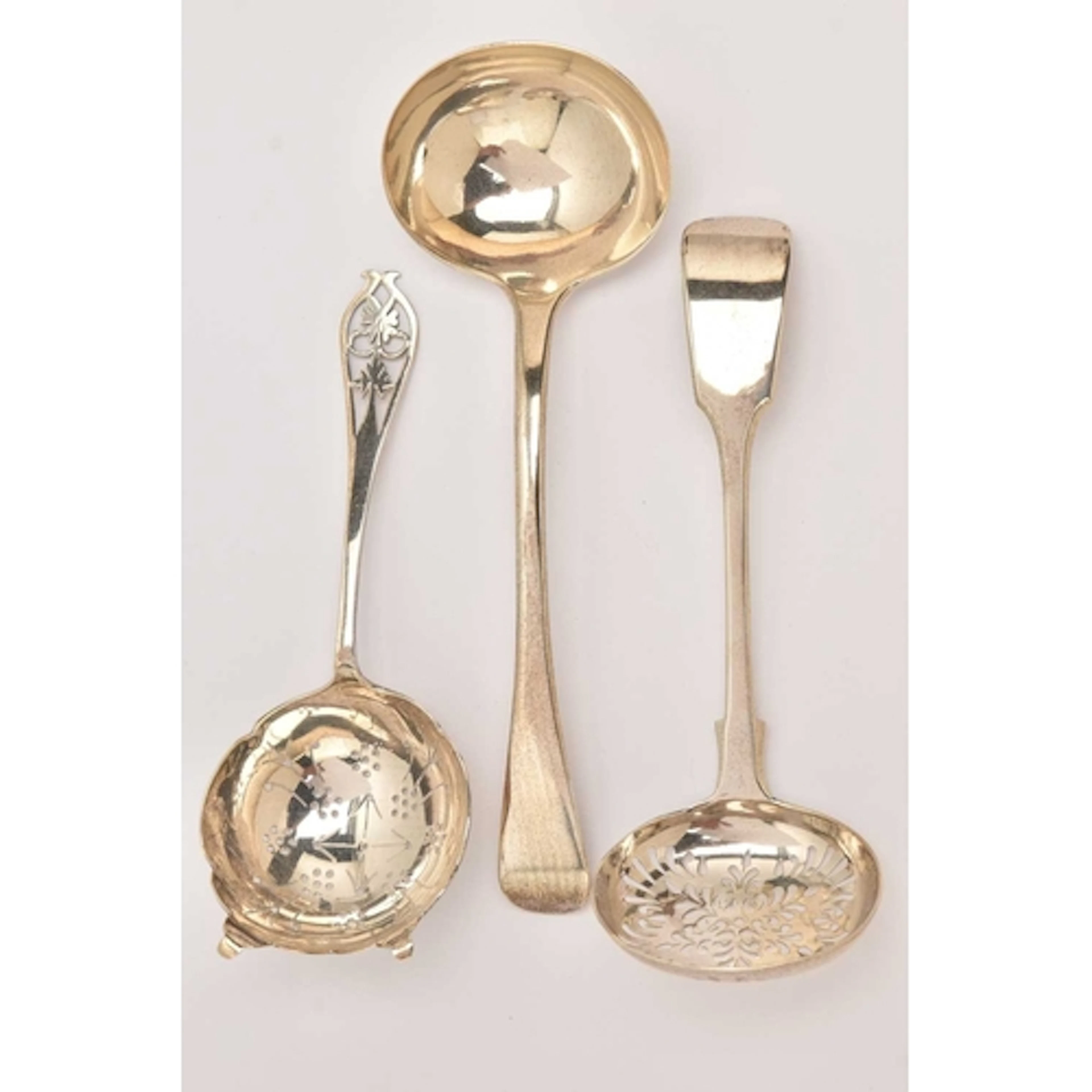 AN ASSORTMENT OF SILVERWARE, to include two strainers and a ...