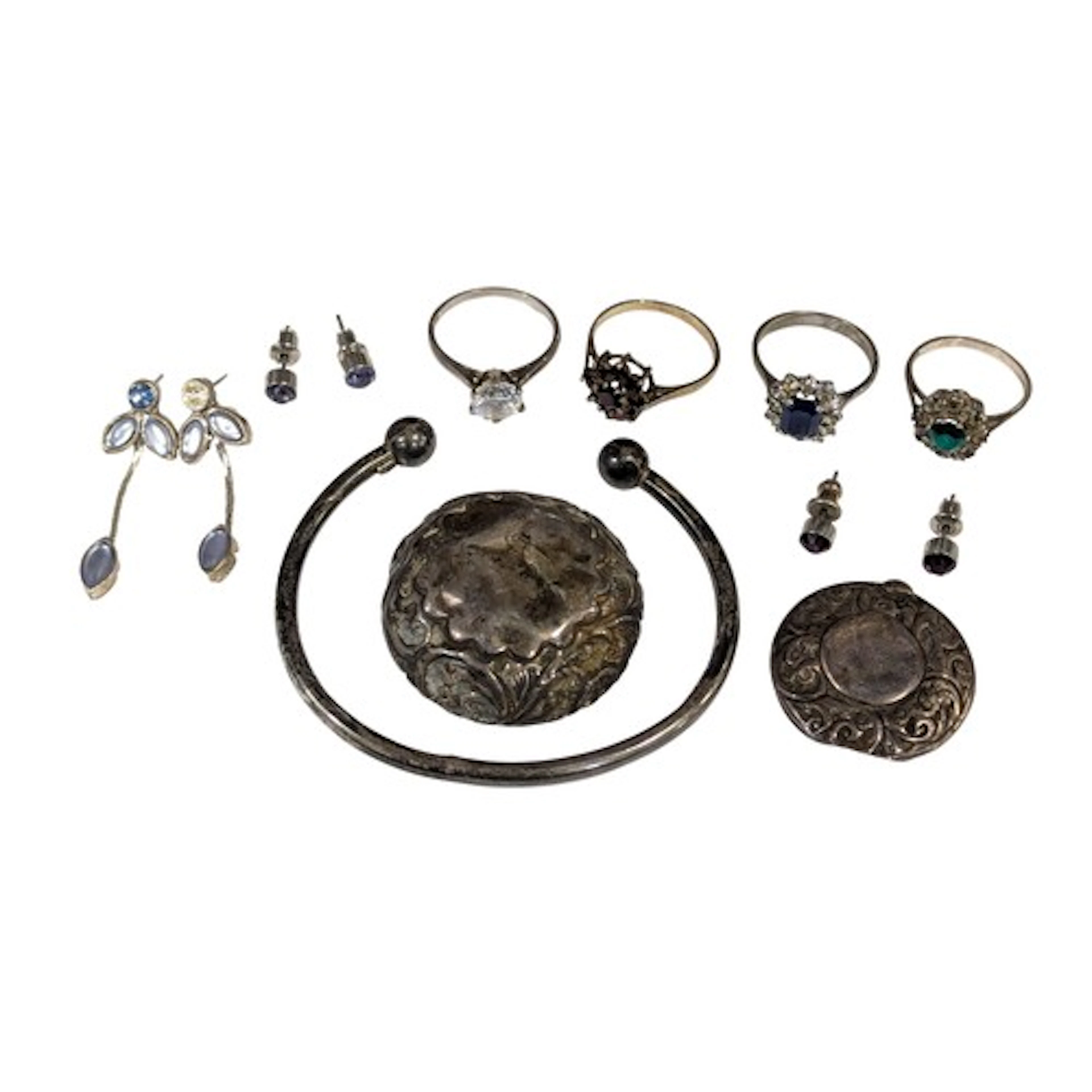 A silver bangle, marked 925, 7.2g; two silver jar tops, 10.5...