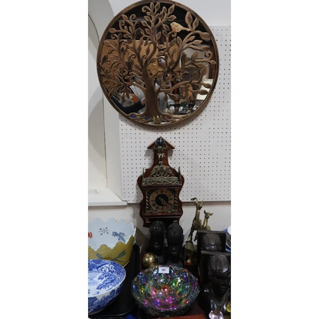 Two pairs of carved wood African heads, an Atlas wall clock,...