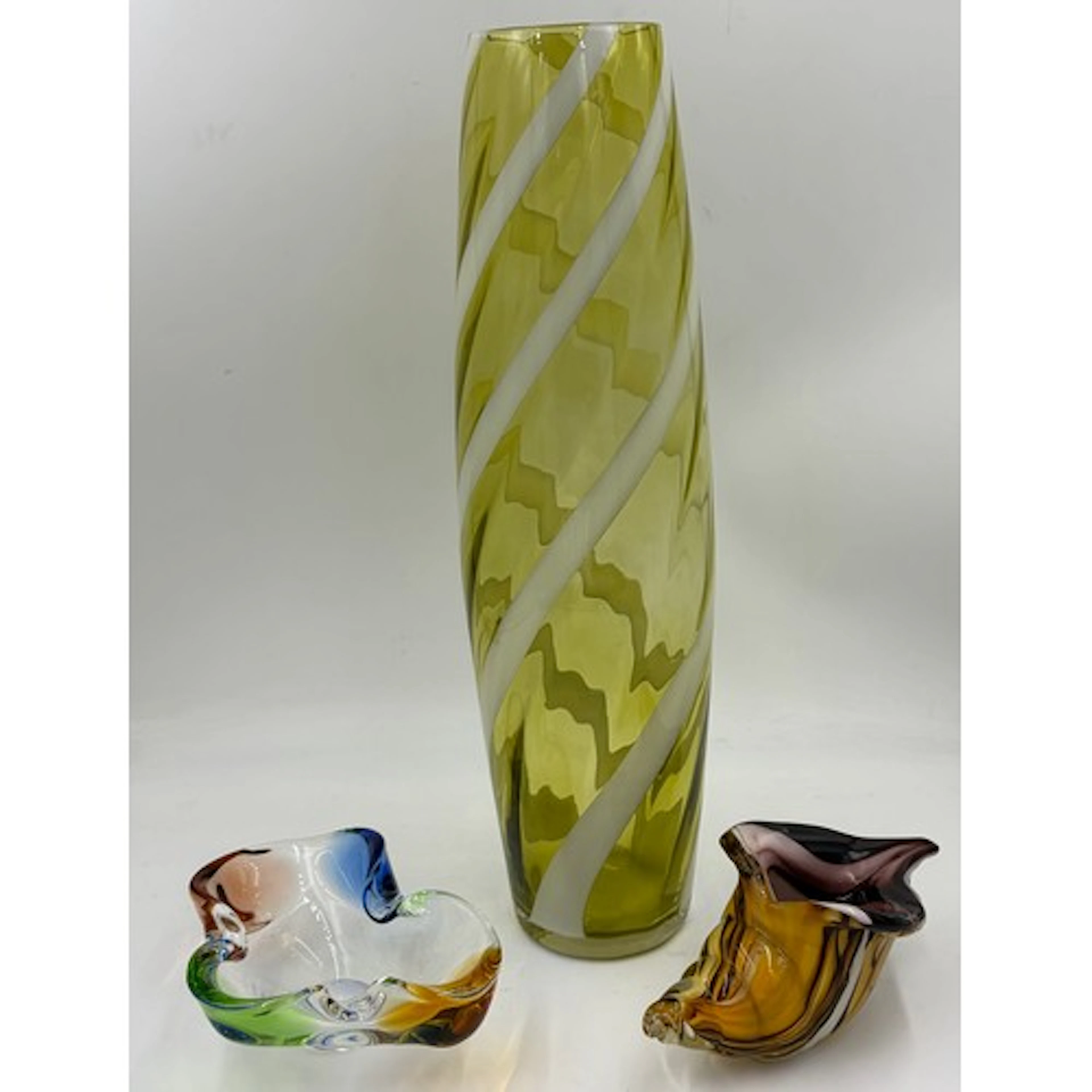 Three pieces of studio glass to include an Empoli, Cristall...