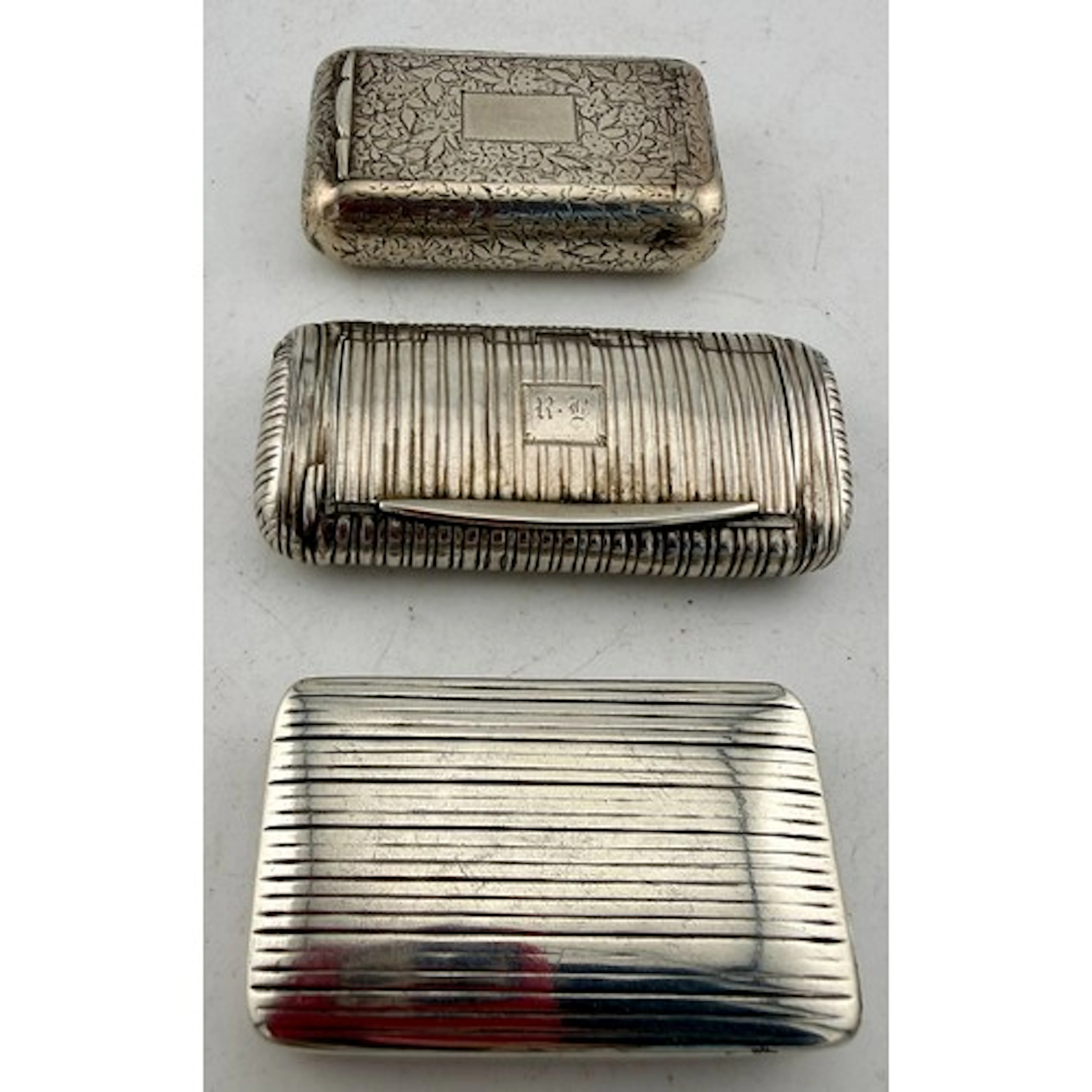 Three hallmarked silver Georgian snuff boxes to include Lond...