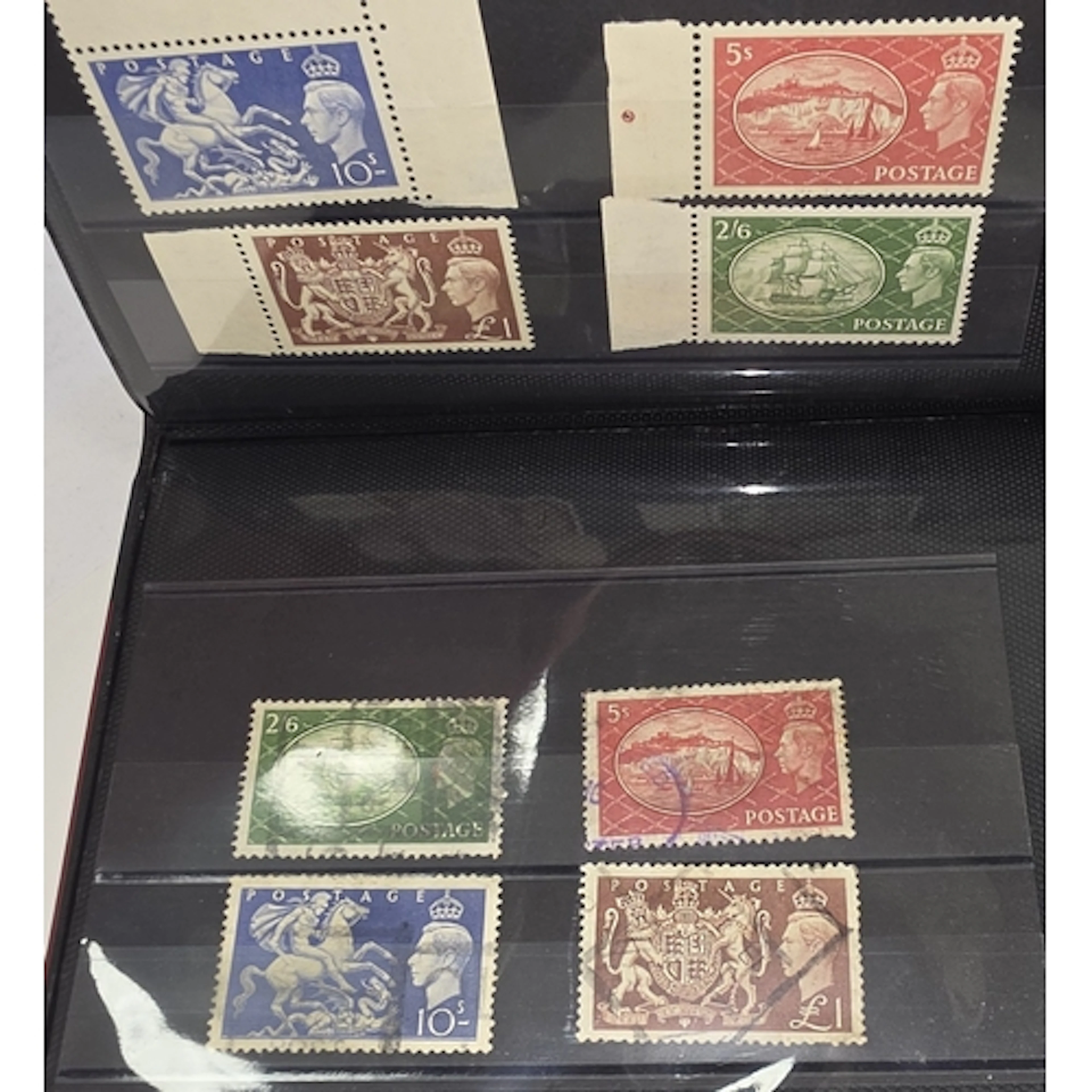An album of Victorian, Edwardian and later high value stamps