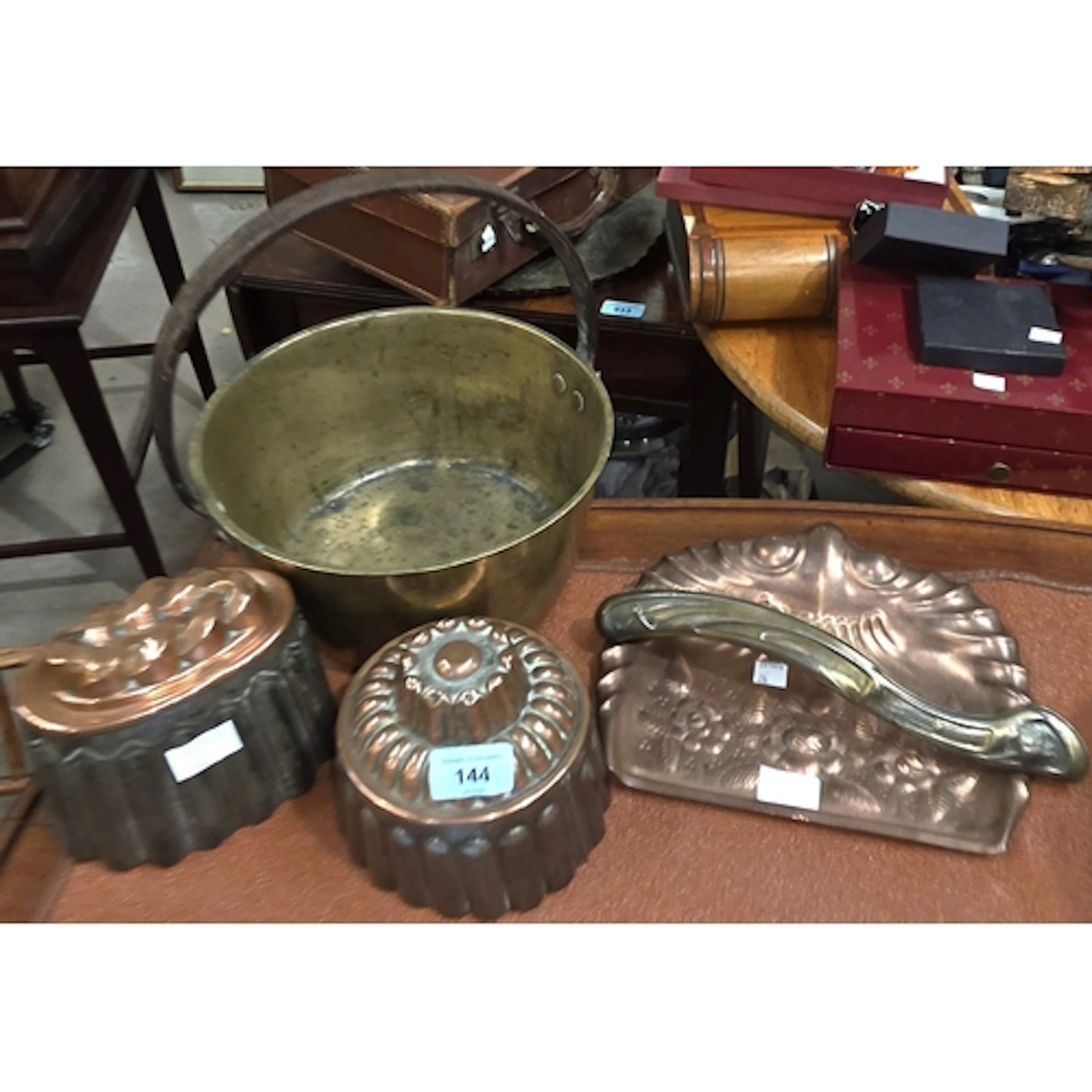 Two 19th century copper and metal jelly moulds, a brass jam ...