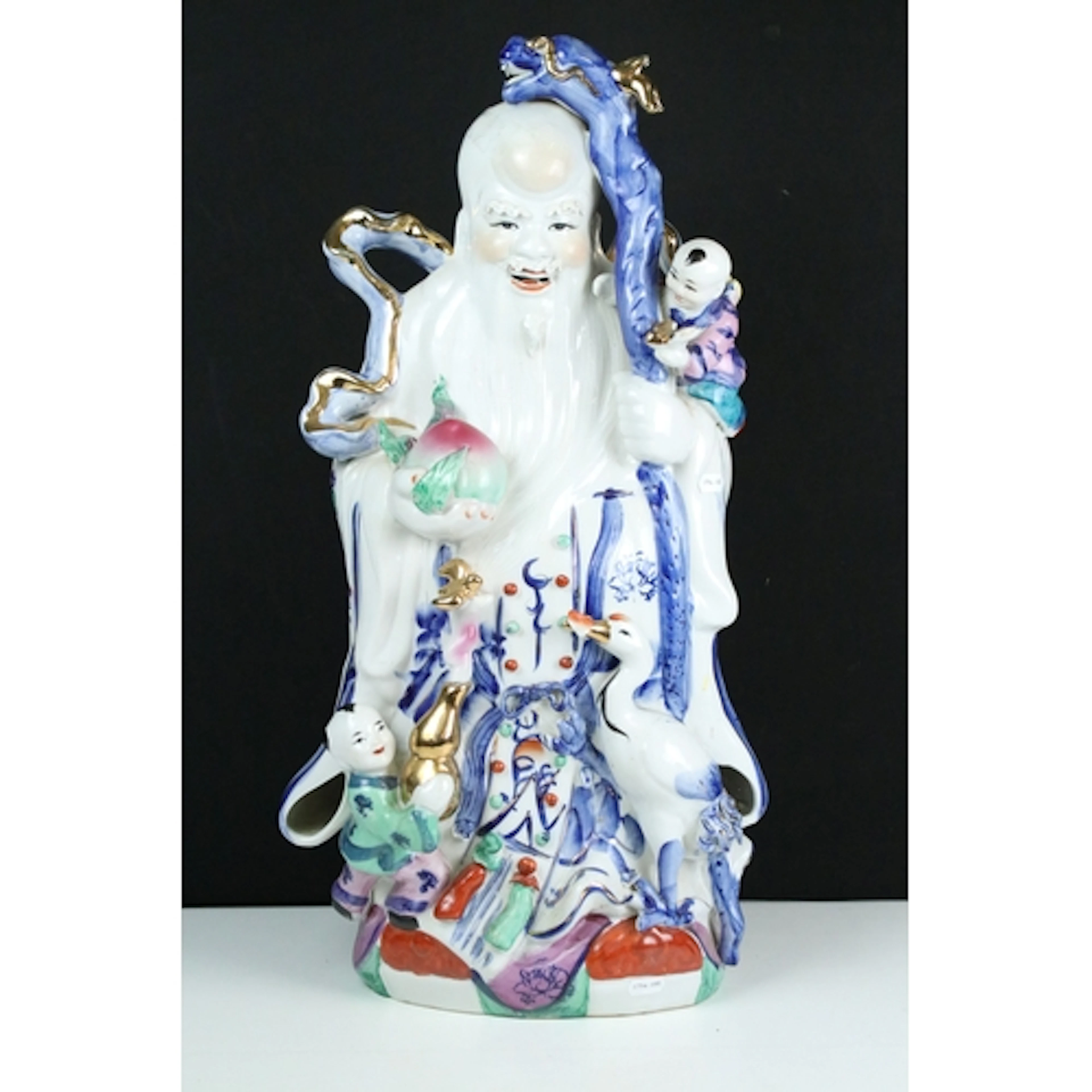20th century porcelain figure of Shouxing with gilt accents,...
