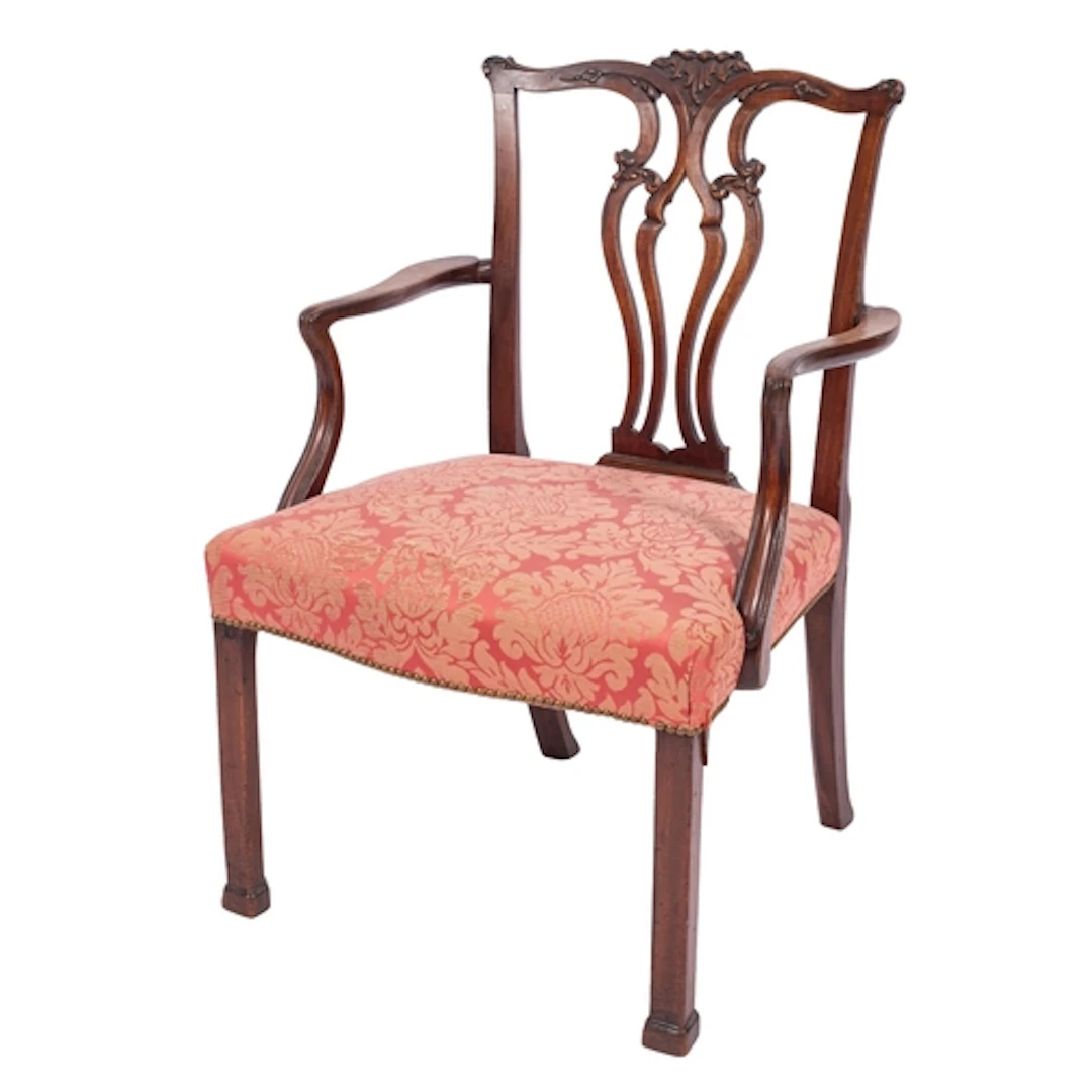 A George III mahogany library elbow chair, circa 1775; the s...