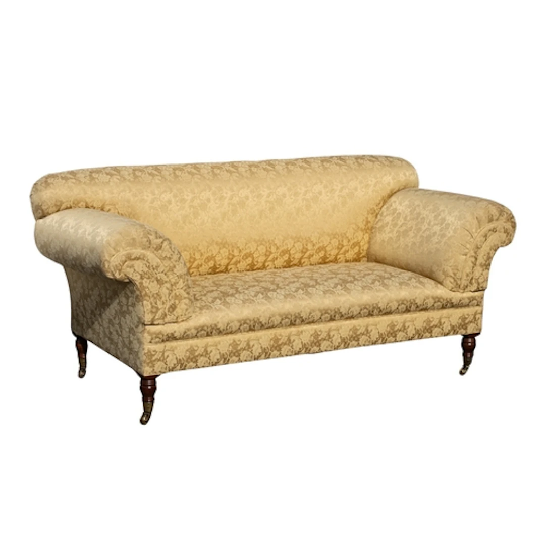 An upholstered sofa in Regency style, modern; with gold colo...