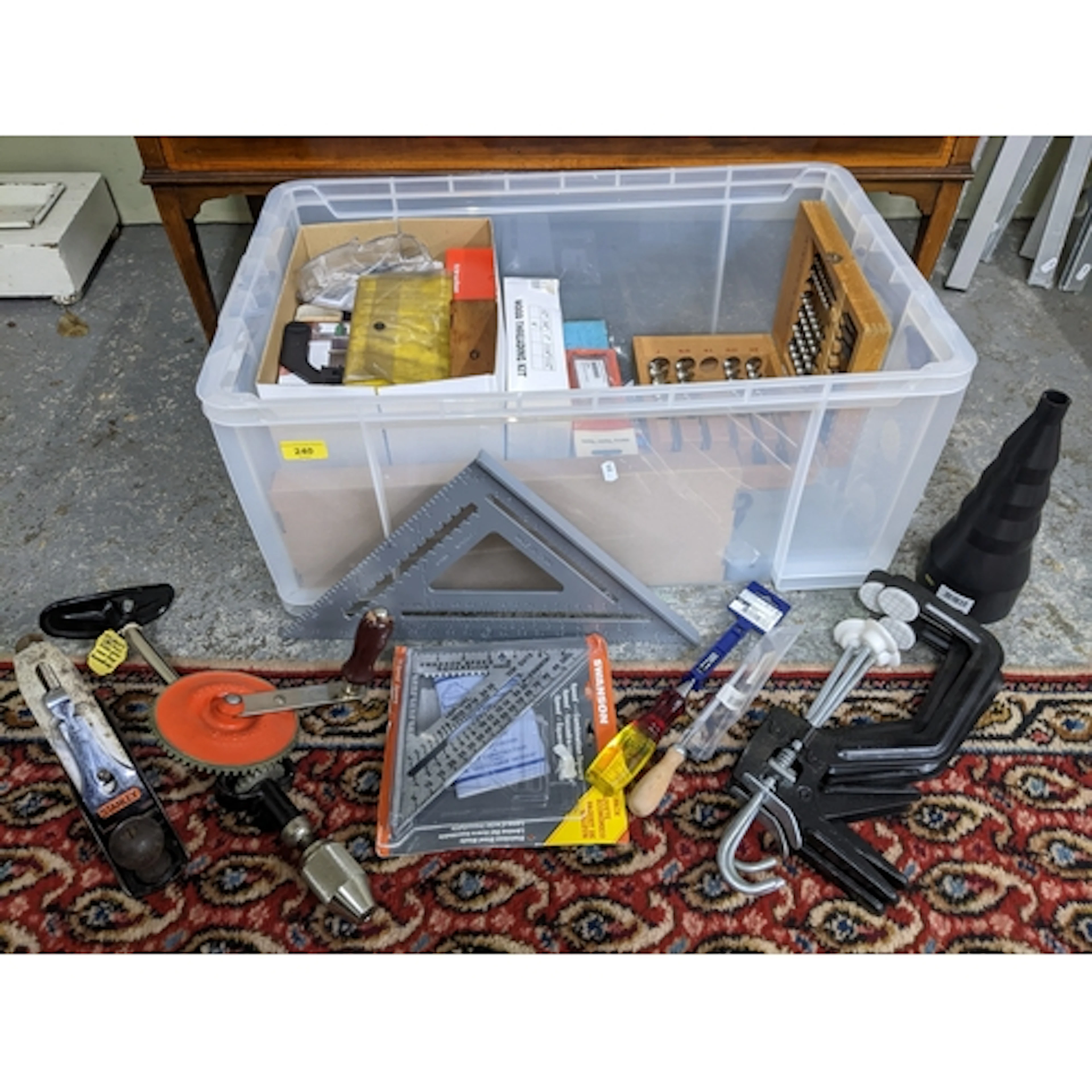 A box of mixed tools to include G-clamps, a Swanson speed an...