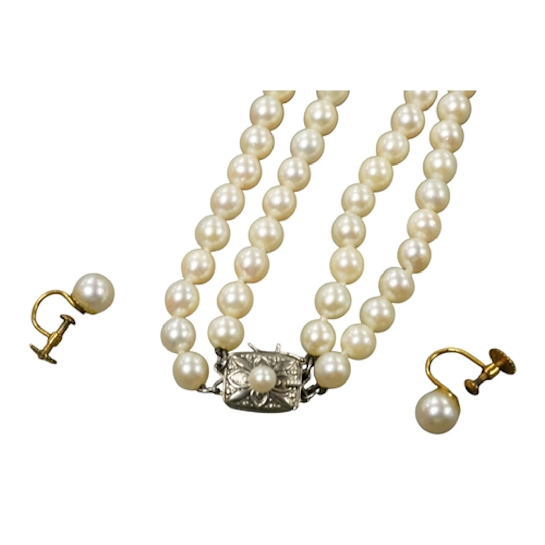 A Mikimoto double strand cultured pearl necklace, with cultu...