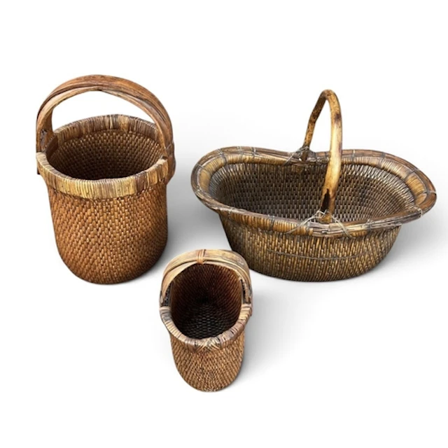 THREE CHINESE RICE BASKETS Largest: 79cm W x 46cm D x 60cm H...