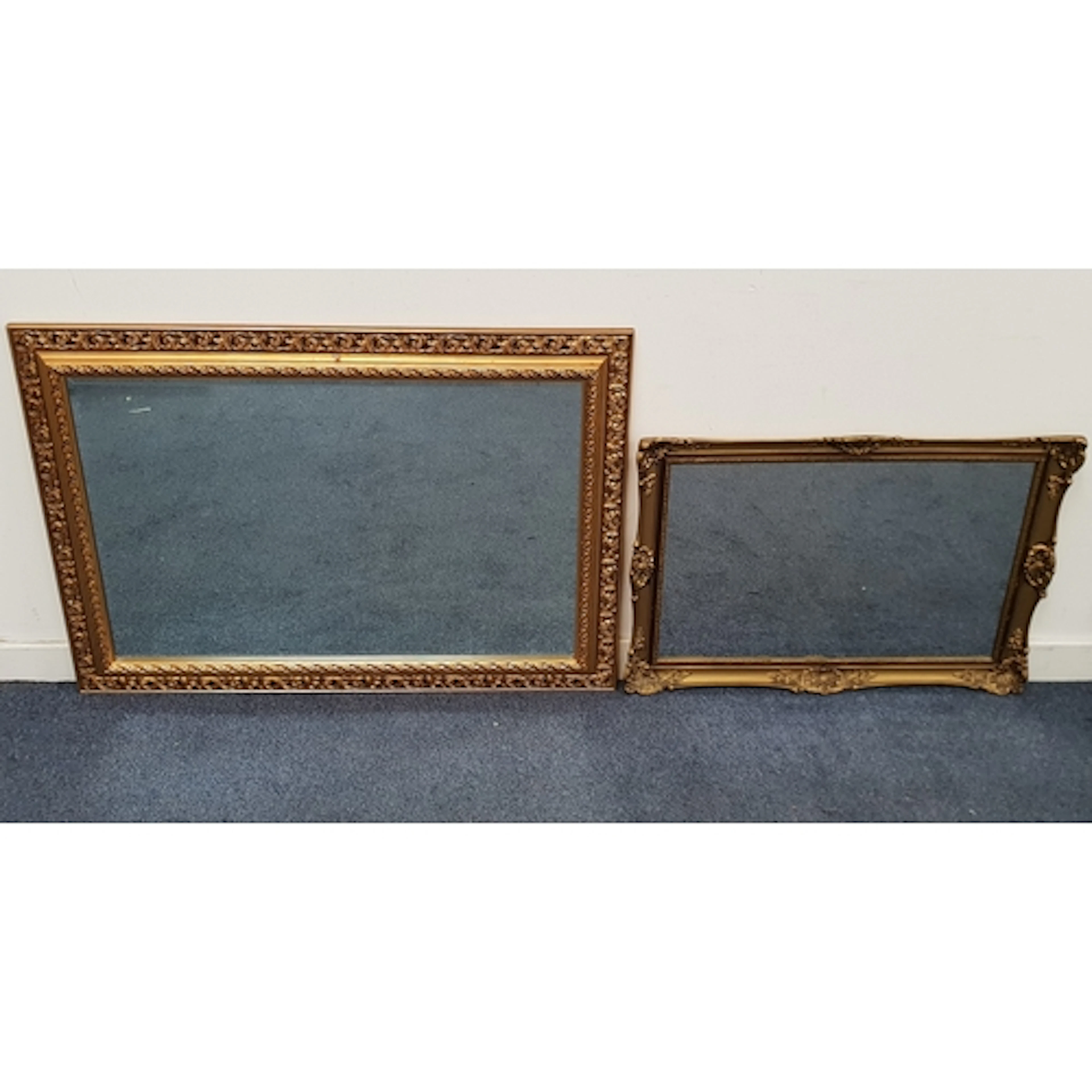 TWO RECTANGULAR GILT FRAMED WALL MIRRORS comprising rectangu...