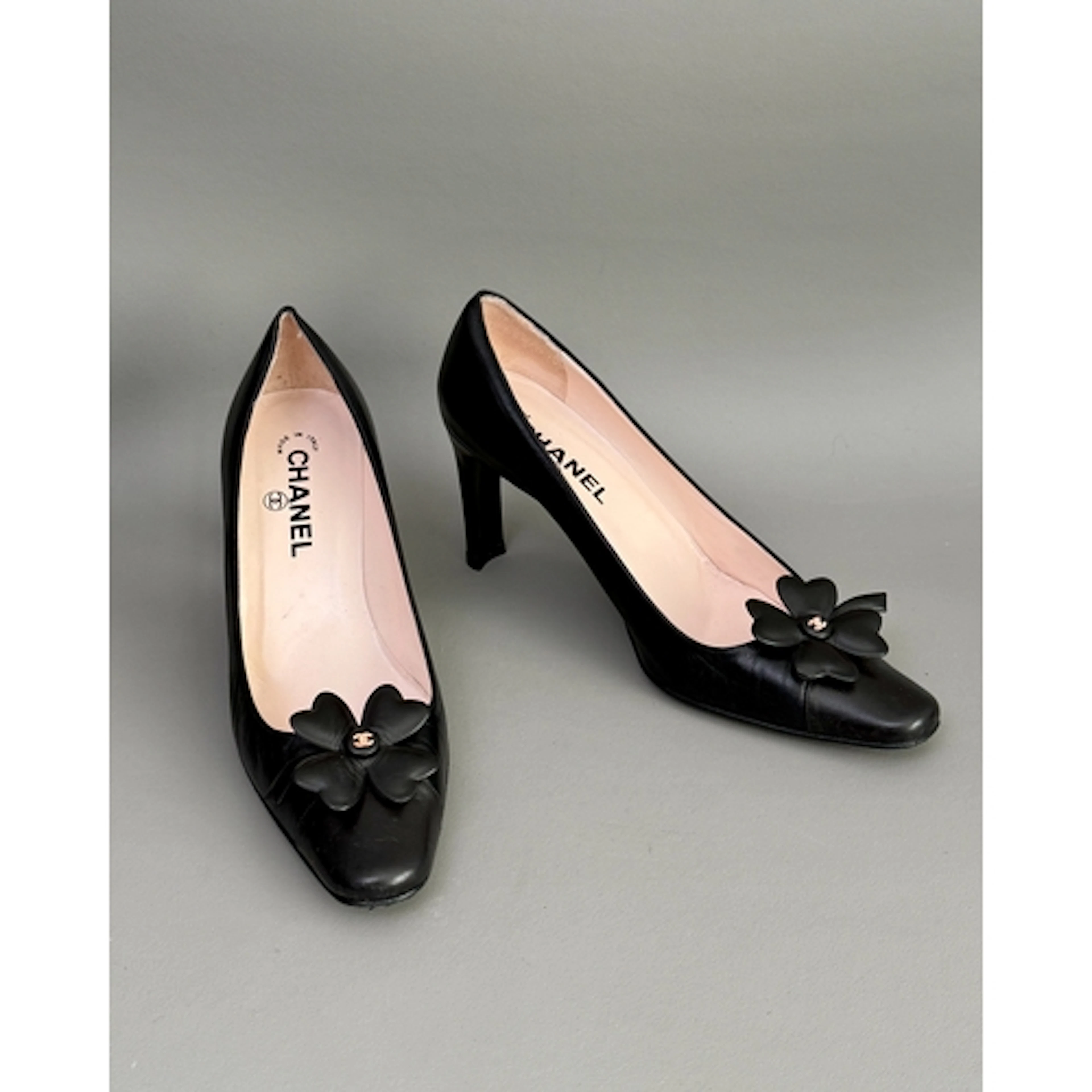 Chanel pumps - the black leather, enclosed court style shoe ...