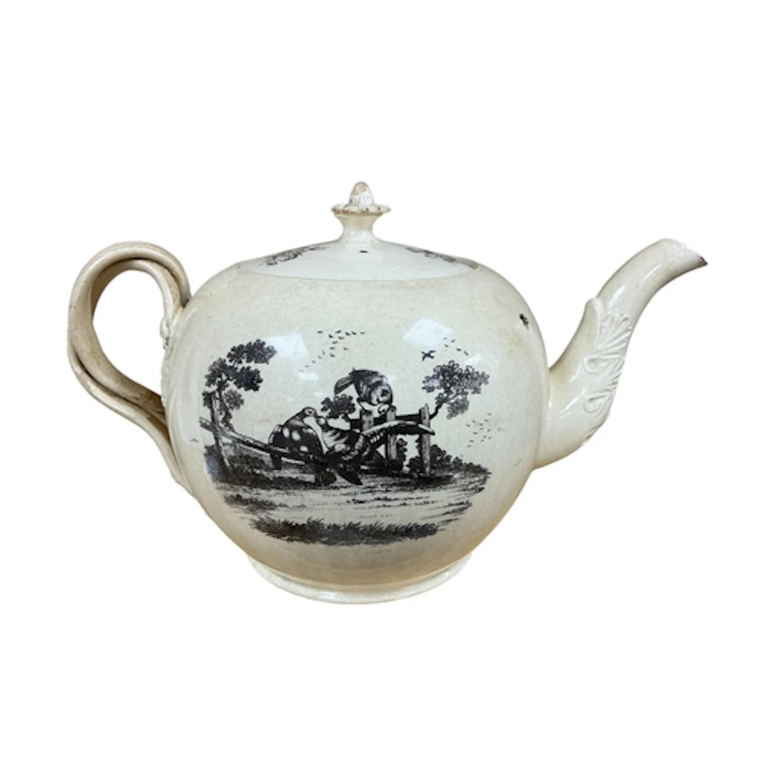 A large 19th century Creamware bullet shaped punch pot print...