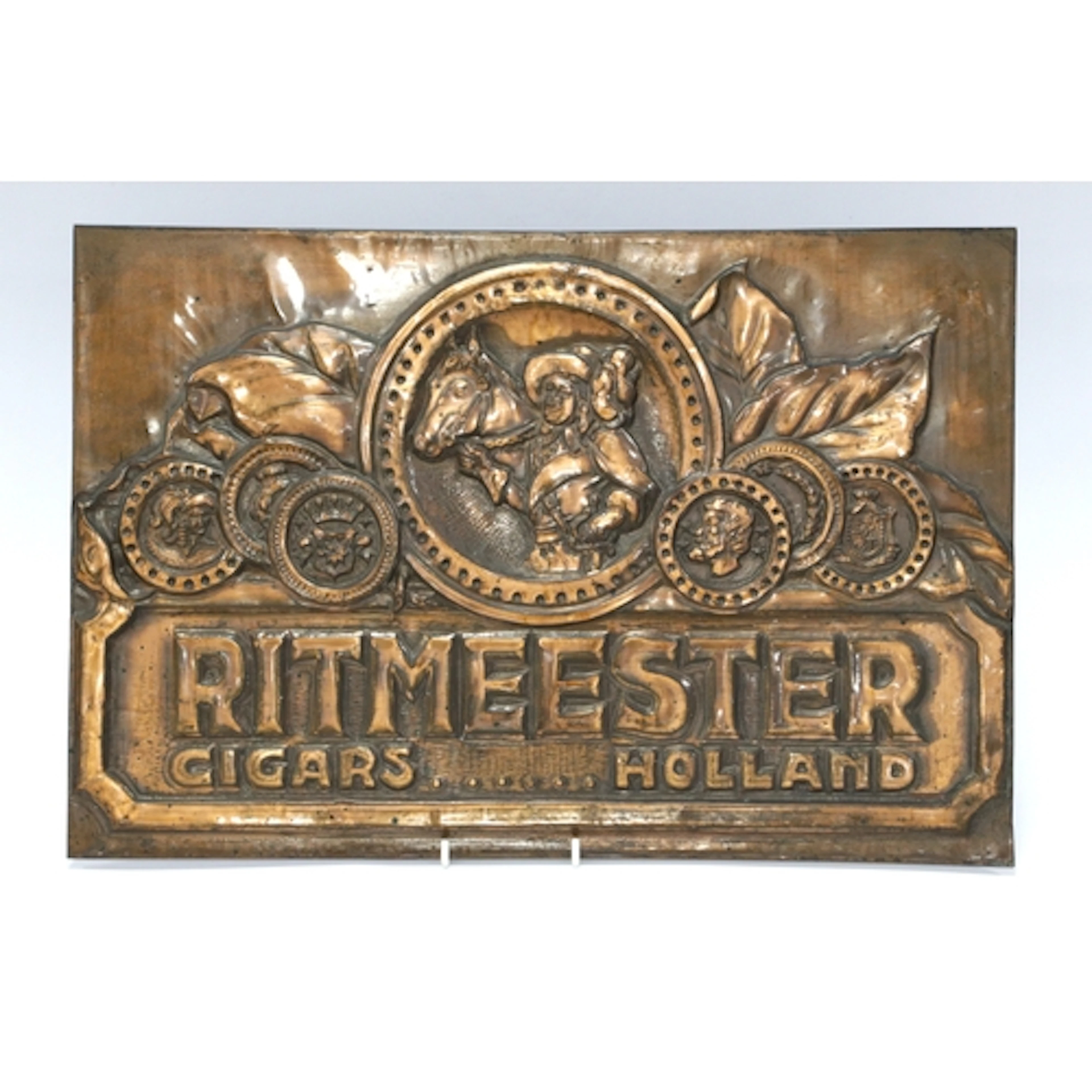 A Mid 1900's Copper Shop Advertising Sign for 'Ritmeester Ci...