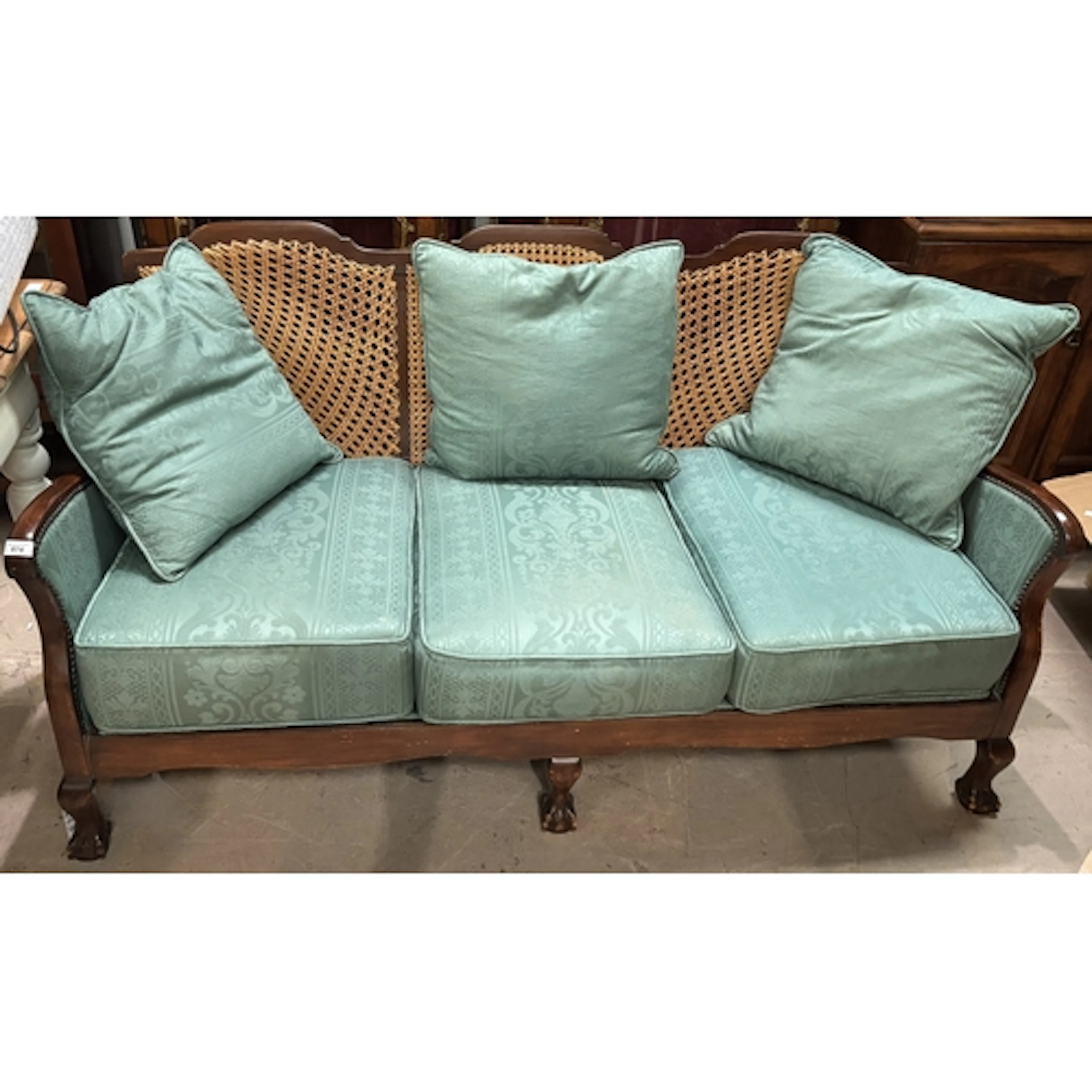 An early 20th century 3 seater sofa on claw and ball foot wi...