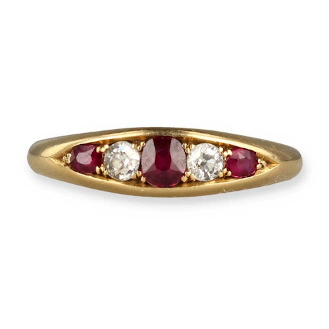 AN 18 CARAT GOLD RUBY AND DIAMOND FIVE STONE RING Weight: 3....
