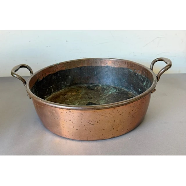 A Twin handled copper preserve pan.