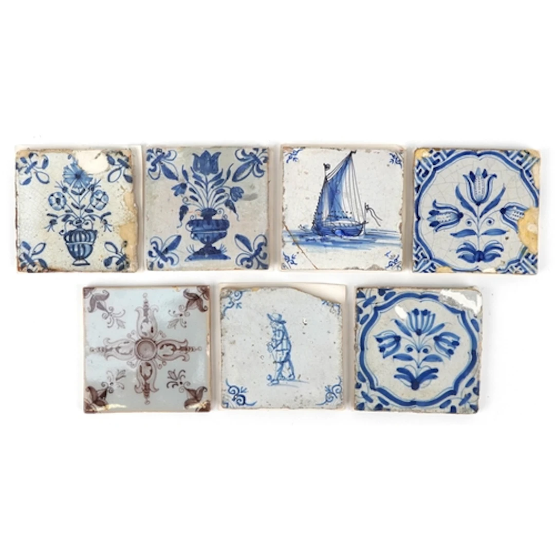 Seven 17th century Dutch pottery tiles, six hand painted in ...