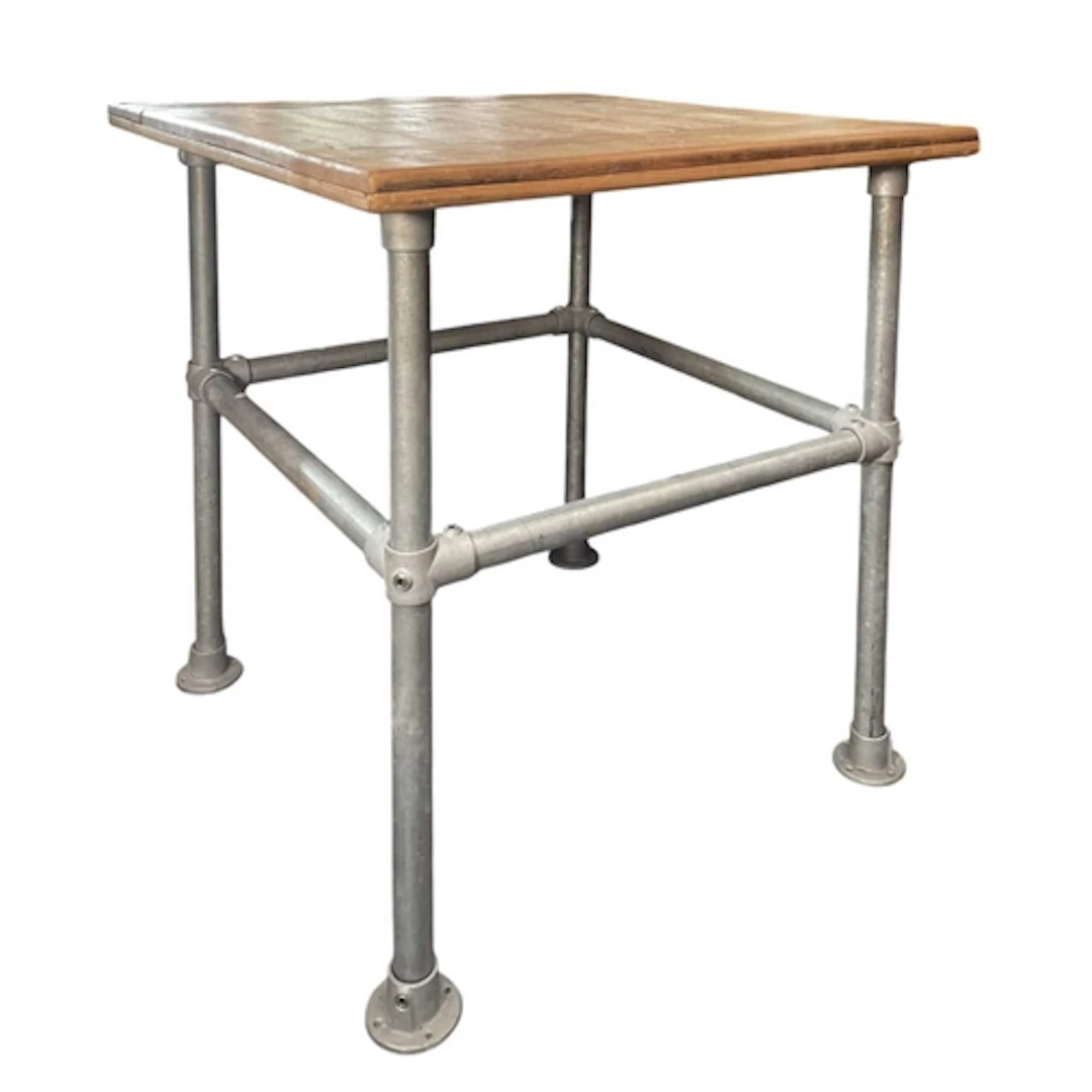 A bespoke made cafe or bar dining table. The table having a ...