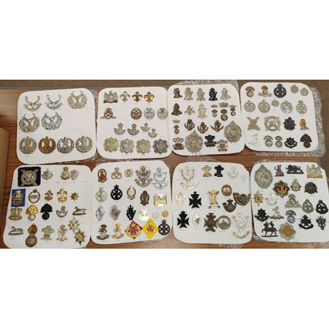 Collection of cap badges from various infantry regiments, in...