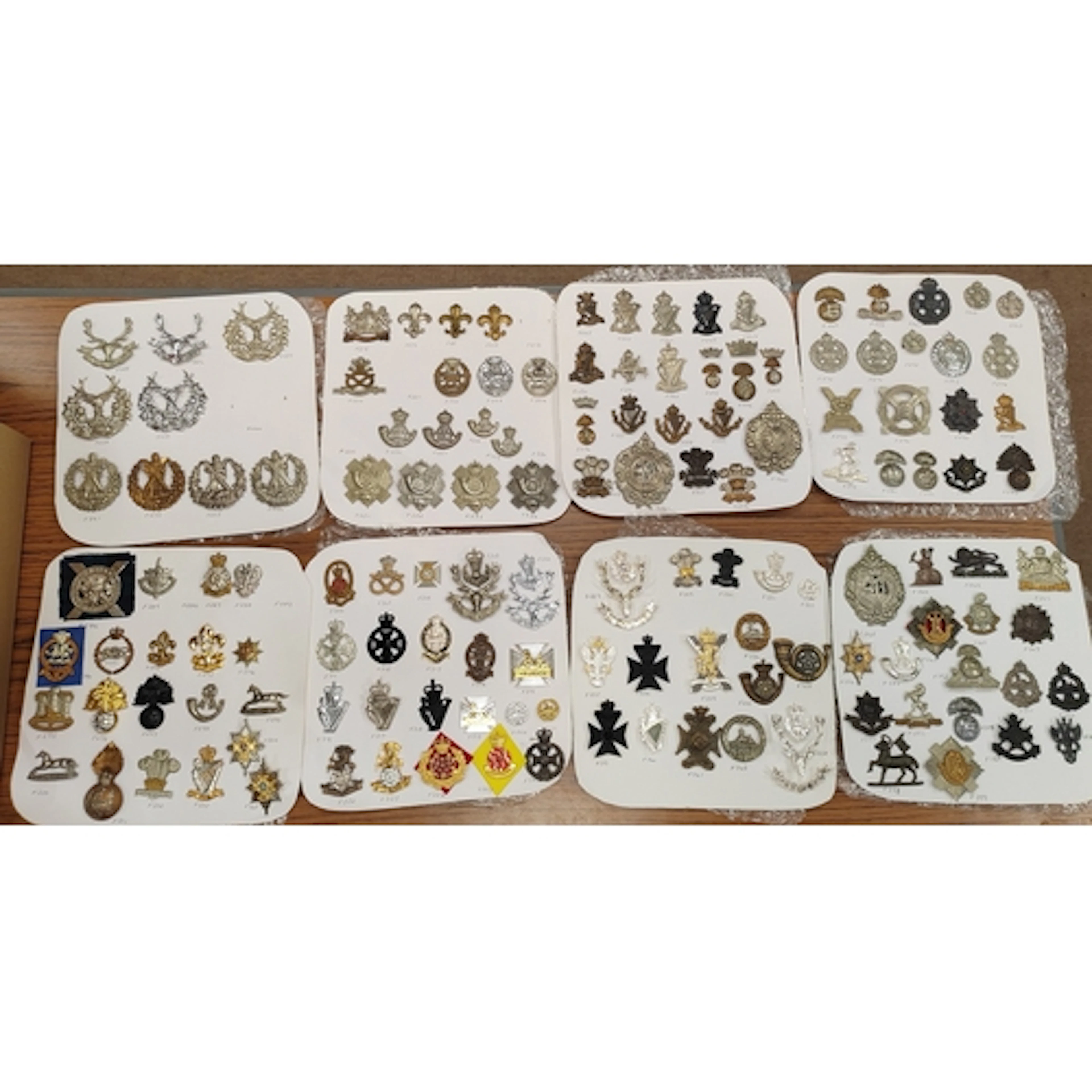 Collection of cap badges from various infantry regiments, in...