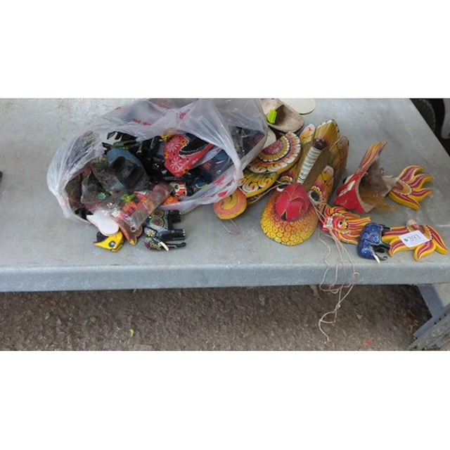 A collection of carved and painted wooden animal figures and...