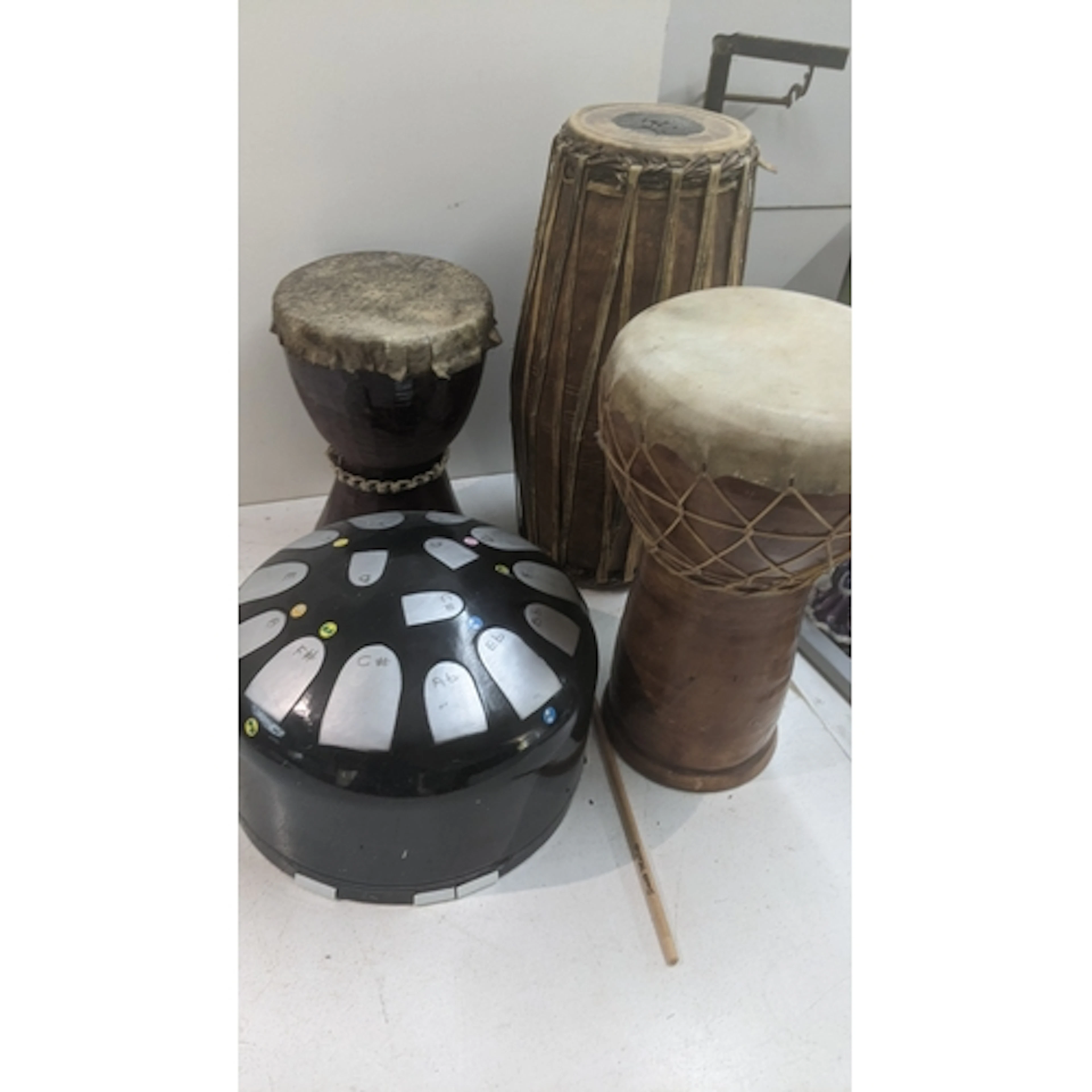 Drums to include a steel tongue drum, djembe drum, a double-...
