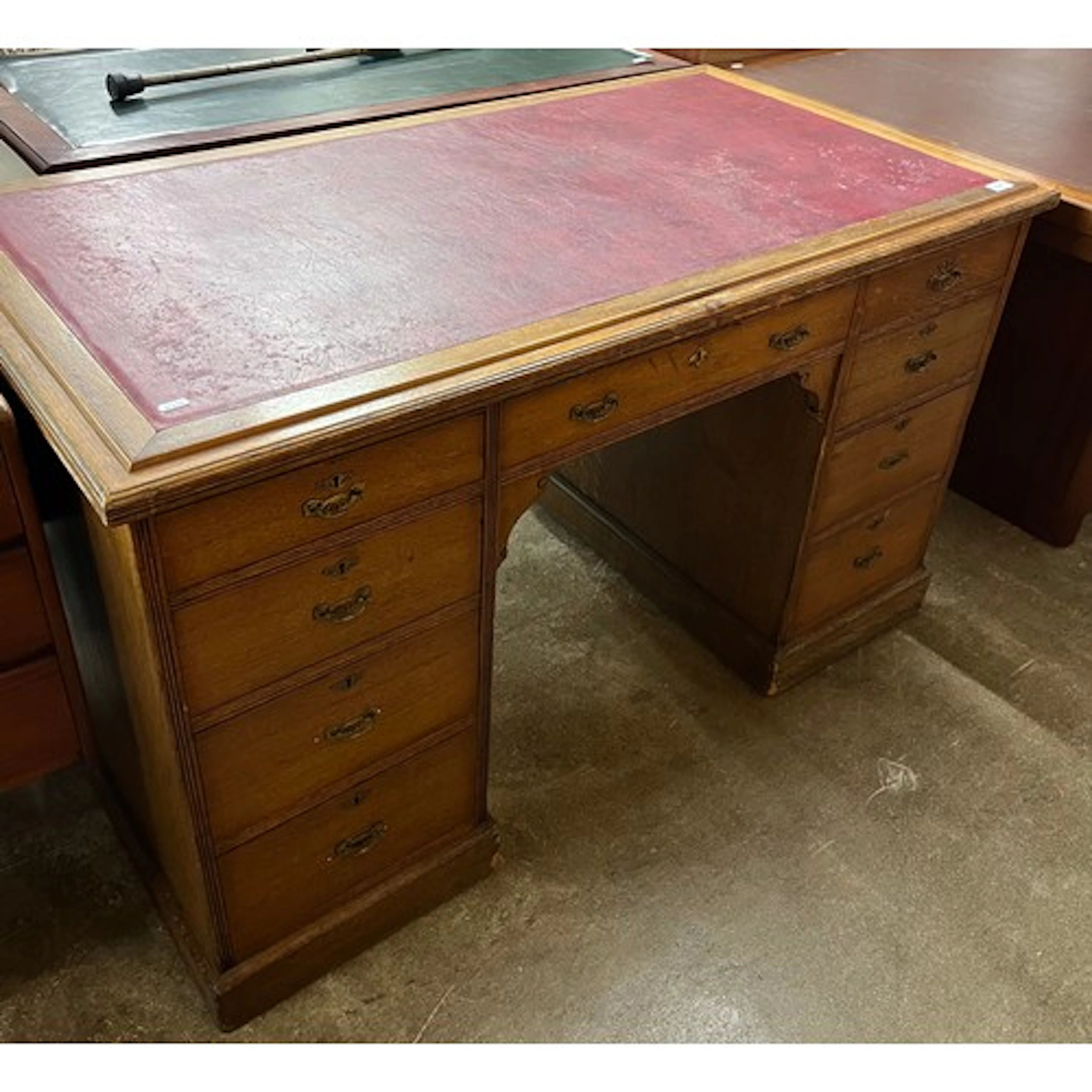 Late Victorian oak kneehole desk, fitted nine drawers, 130cm...